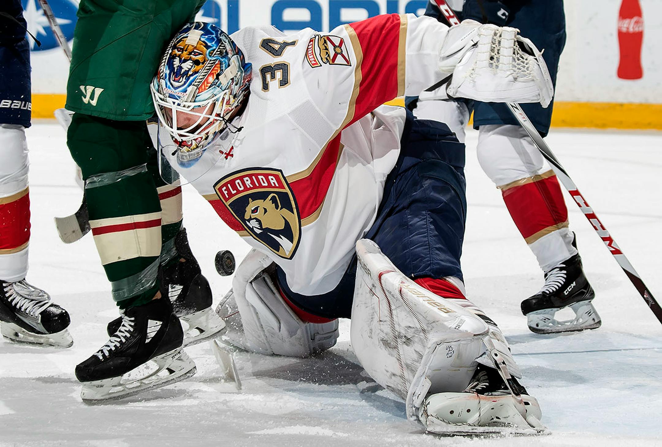 Matt Cullen (not seen in photo) got the puck past Panthers goalie James Reimer (34) for a goal in the first period.
