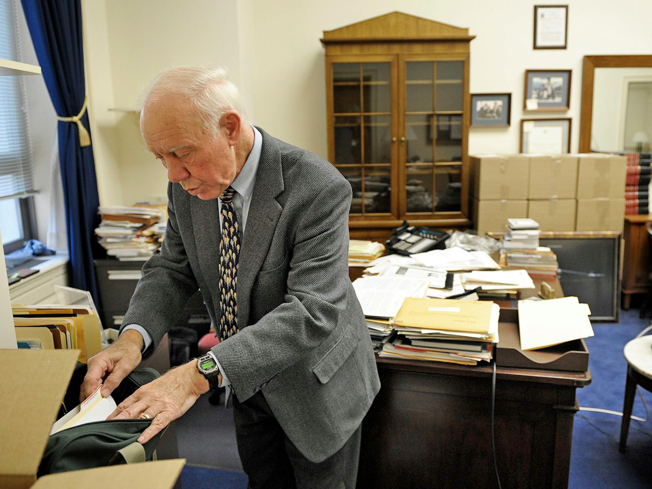 ** SPECIAL TO THE MINNEAPOLIS STAR TRIBUNE ** SA 232340 ** After serving 18-terms, Rep. Jim Oberstar, D-MN, identifies important documents for his staff to pack in his office on Capitol Hill in Washington, Monday, Nov. 29, 2010. Oberstar lost to Republican Chip Cravaack by approximately 4,000 votes. (AP Photo/Cliff Owen)