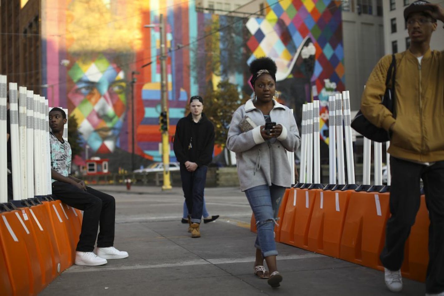 People walked to the light rail station Wednesday evening on S. 5th St. at Hennepin Ave.