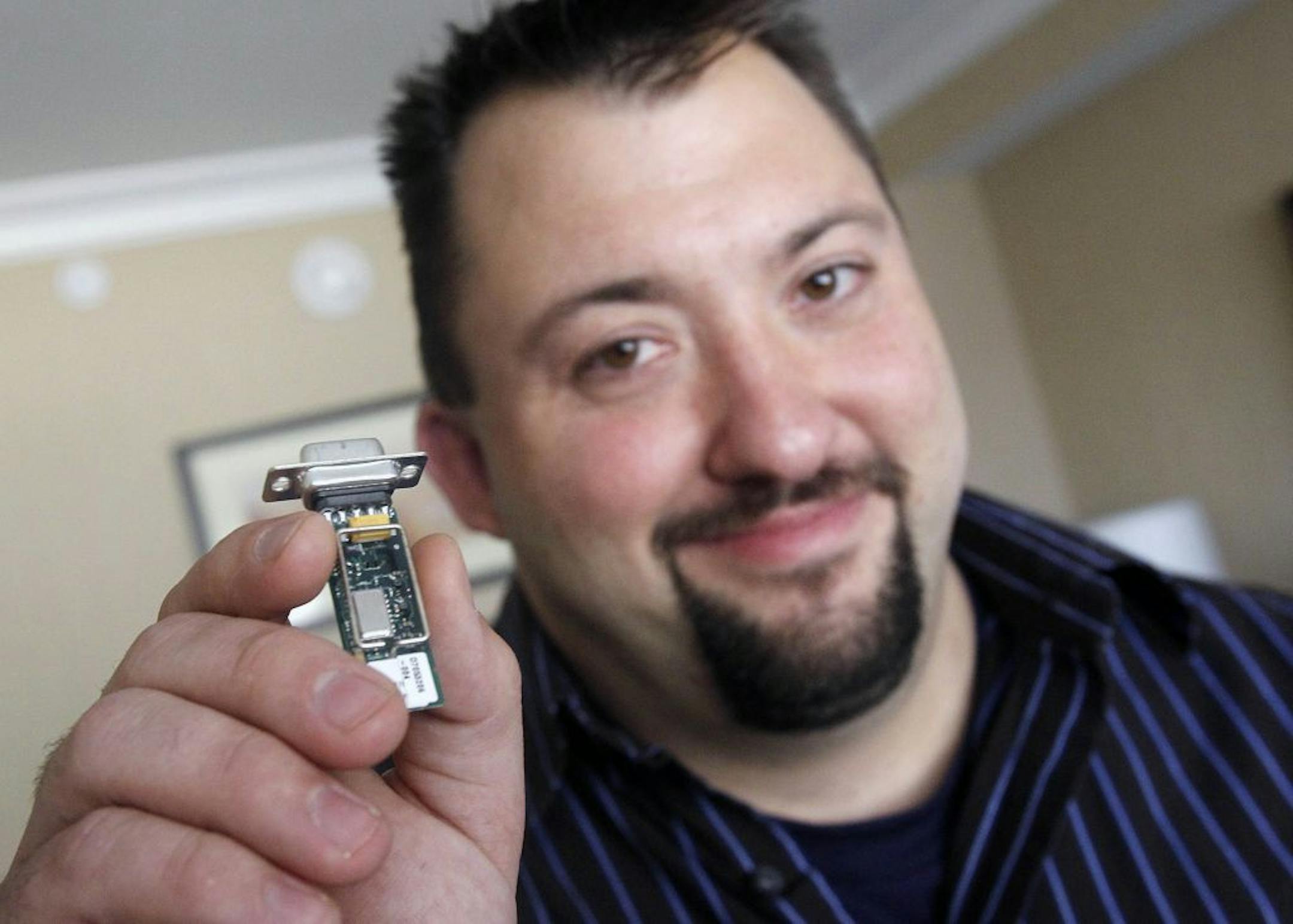 Jay Radcliffe, displays a radio device he uses to perform an attack on an insulin pump, taking control of the device wirelessly, at the annual Black Hat conference for digital self defense Thursday, Aug. 4, 2011, in Las Vegas. Even the human bloodstream isn't safe from computer hackers.Radcliffe, a security researcher who is diabetic has identified flaws that could allow an attacker to remotely control insulin pumps and alter the readouts of blood-sugar monitors. As a result, diabetics could get