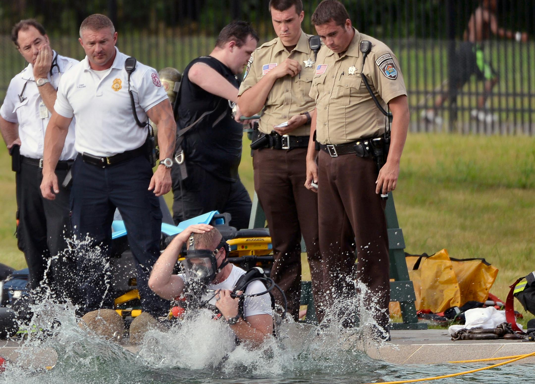 Fire officials searched for a body in Webber Pool in Minneapolis Minn., on Saturday July 25, 2015. No body was found and the pool will resume normal hours on Sunday July 26, 2015. ] RACHEL WOOLF ∑ rachel.woolf@startribune.com ORG XMIT: MIN1507251914542422