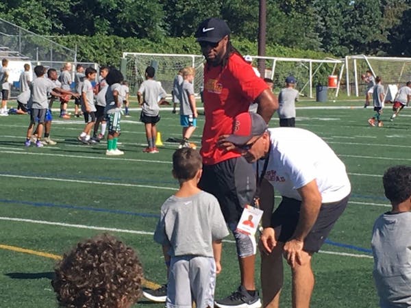 Larry Fitzgerald looked on during a football camp he sponsored this summer at Academy of Holy Angels in Richfield.