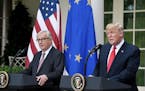 U.S. President Donald Trump speaks as European Commission President Jean-Claude Juncker looks on during a press conference on Wednesday, July 25, 2018