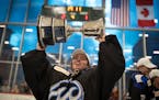 Minnesota Whitecaps goaltender Amanda Leveille celebrates with the Isobel Cup at Tria Rink on Sunday, March 17, 2019 in St. Paul, Minn. The Whitecaps 