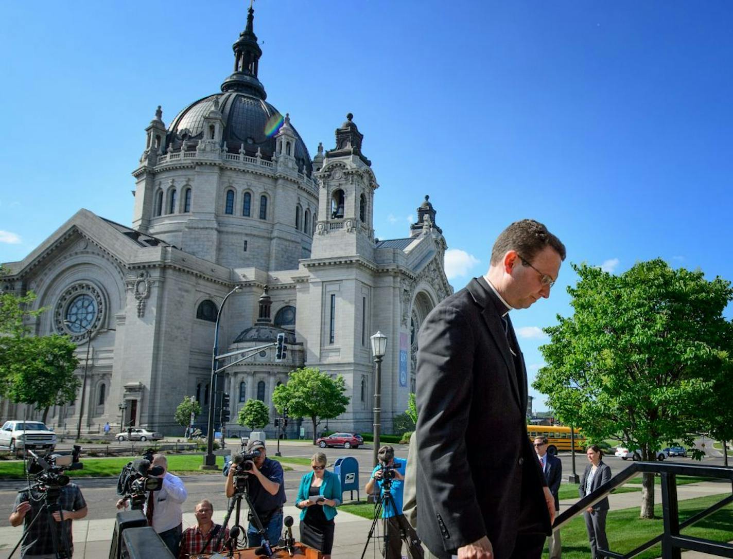 Auxiliary Bishop Andrew Cozzens walked back into the chancery after he and Tim O'Mally, director of ministerial standards and safe environment, responded to the charges against the St. Paul and Minneapolis Archdiocese.