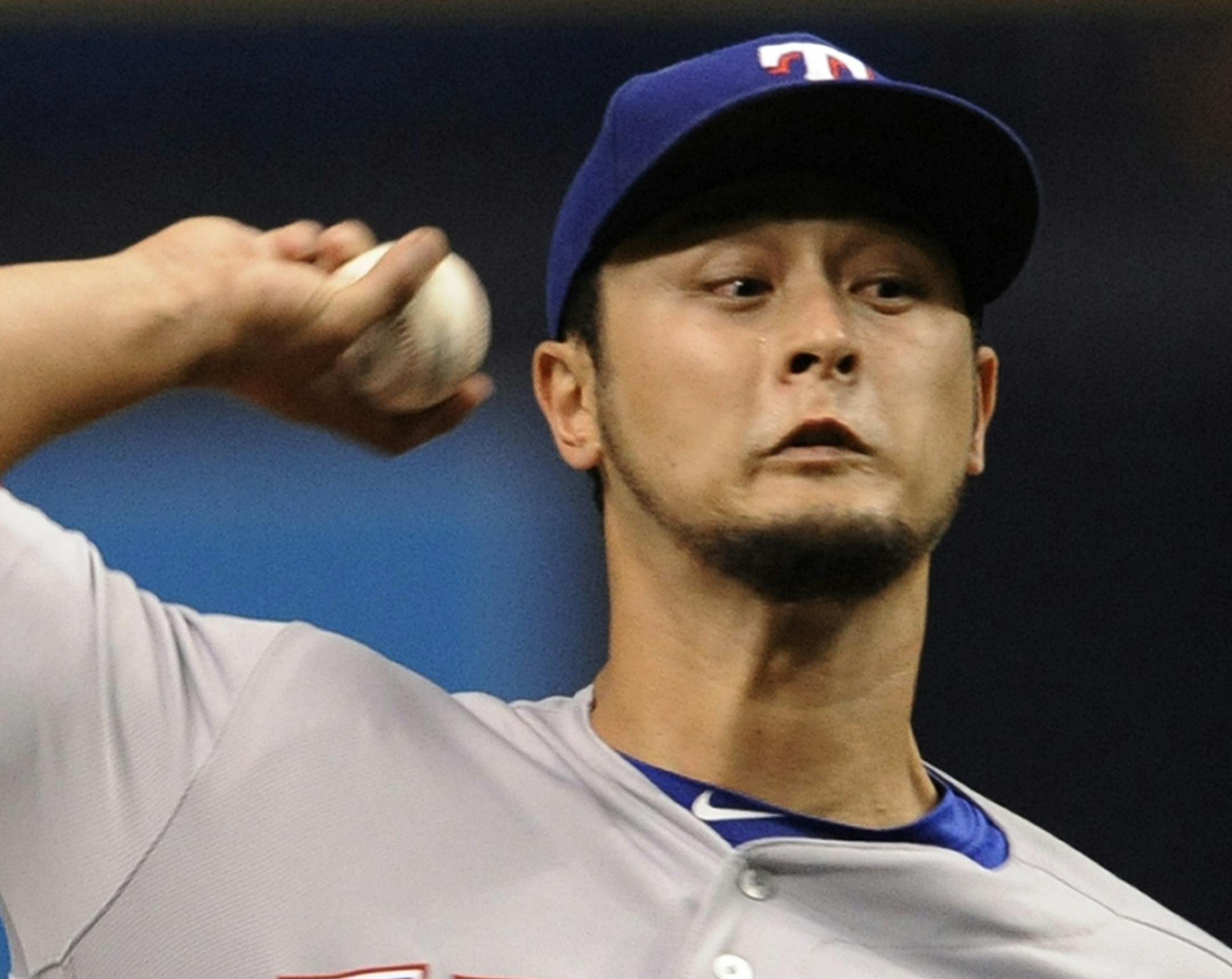 Texas Rangers starter Yu Darvish pitches against the Tampa Bay Rays during the first inning of a baseball game Friday, July 21, 2017, in St. Petersburg, Fla. (AP Photo/Steve Nesius)