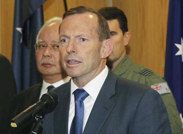 April 3, 2014: Australian Prime Minister Tony Abbott, right, speaks as Malaysia Prime Minister Najib Razak, left, looks on.