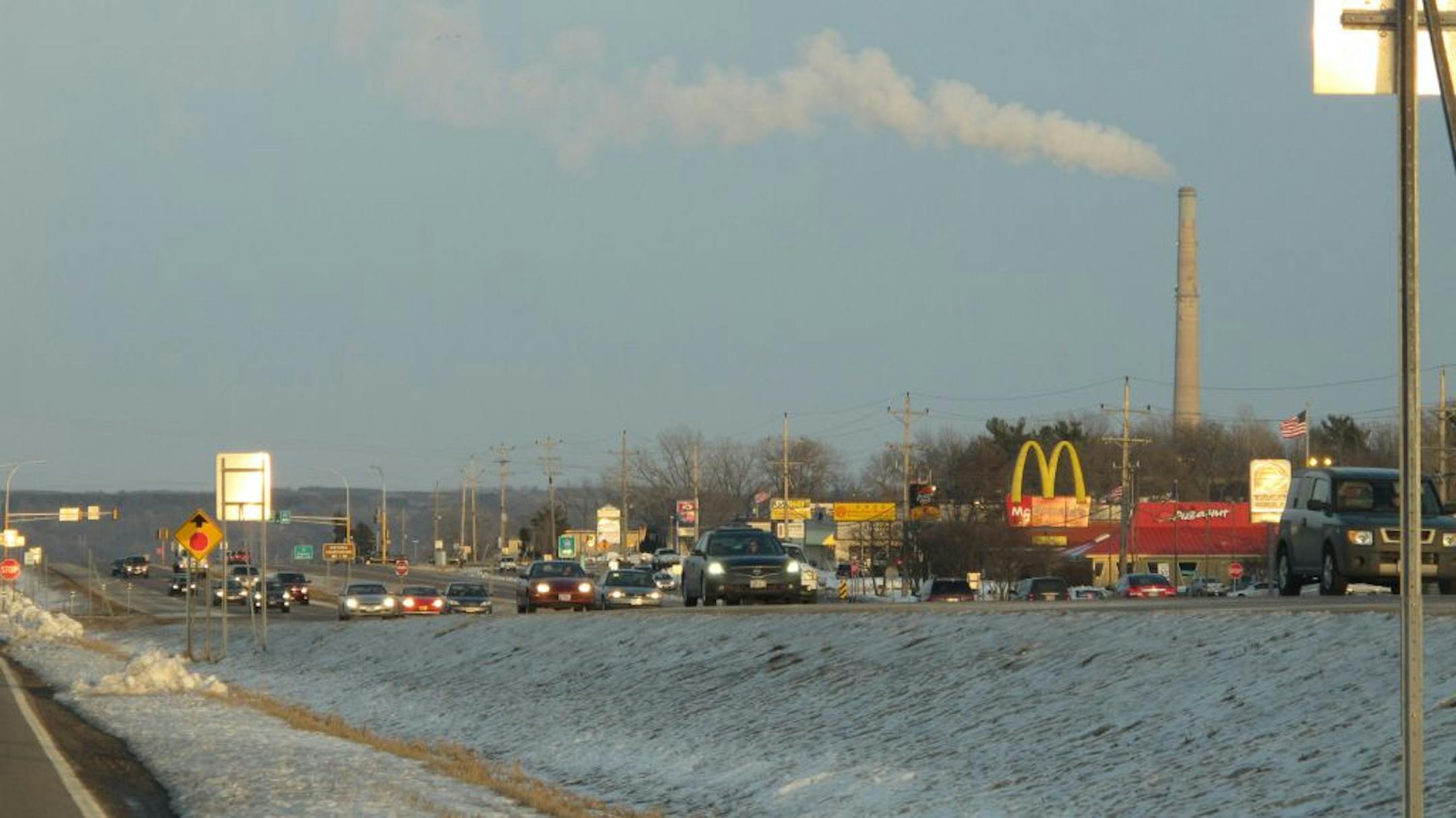 Kevin Giles � kgiles@startribune.comDozens of businesses flank the four-lane Hwy. 36 through Oak Park Heights. Two-lane frontage roads on either side of the highway funnel customers to the businesses. This view looks east to the bluffs of western Wisconsin.