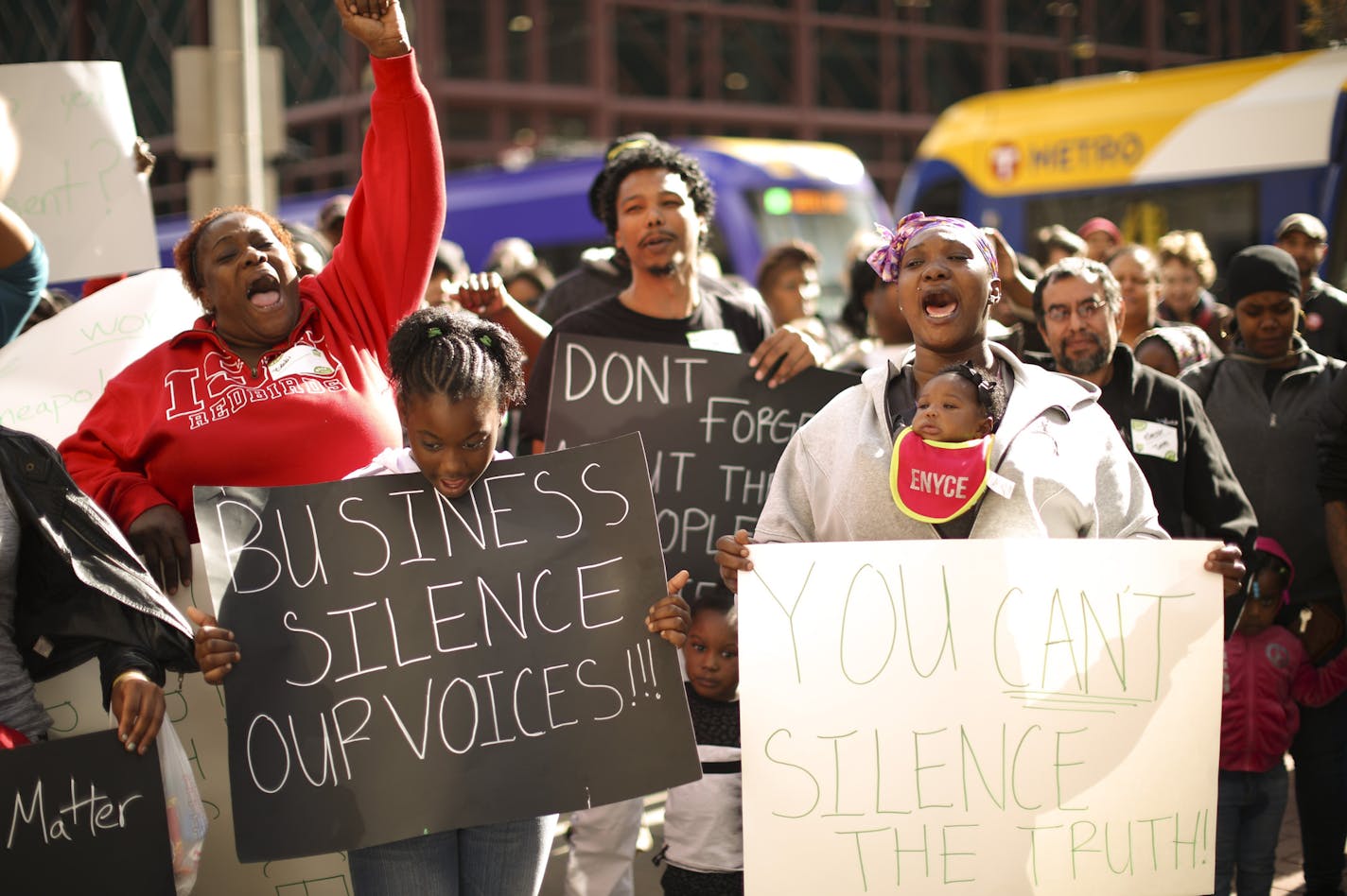 Demonstrators chanted &#x201c;Black Workers Matter!&#x201d; before they entered City Hall for a silent march through the halls Thursday afternoon. At right was Rosheeda Credit, who works at Target Field, joined in the chants with her daughter, Sha&#x2019;rya Jenkins in front of her mother in a carrier.