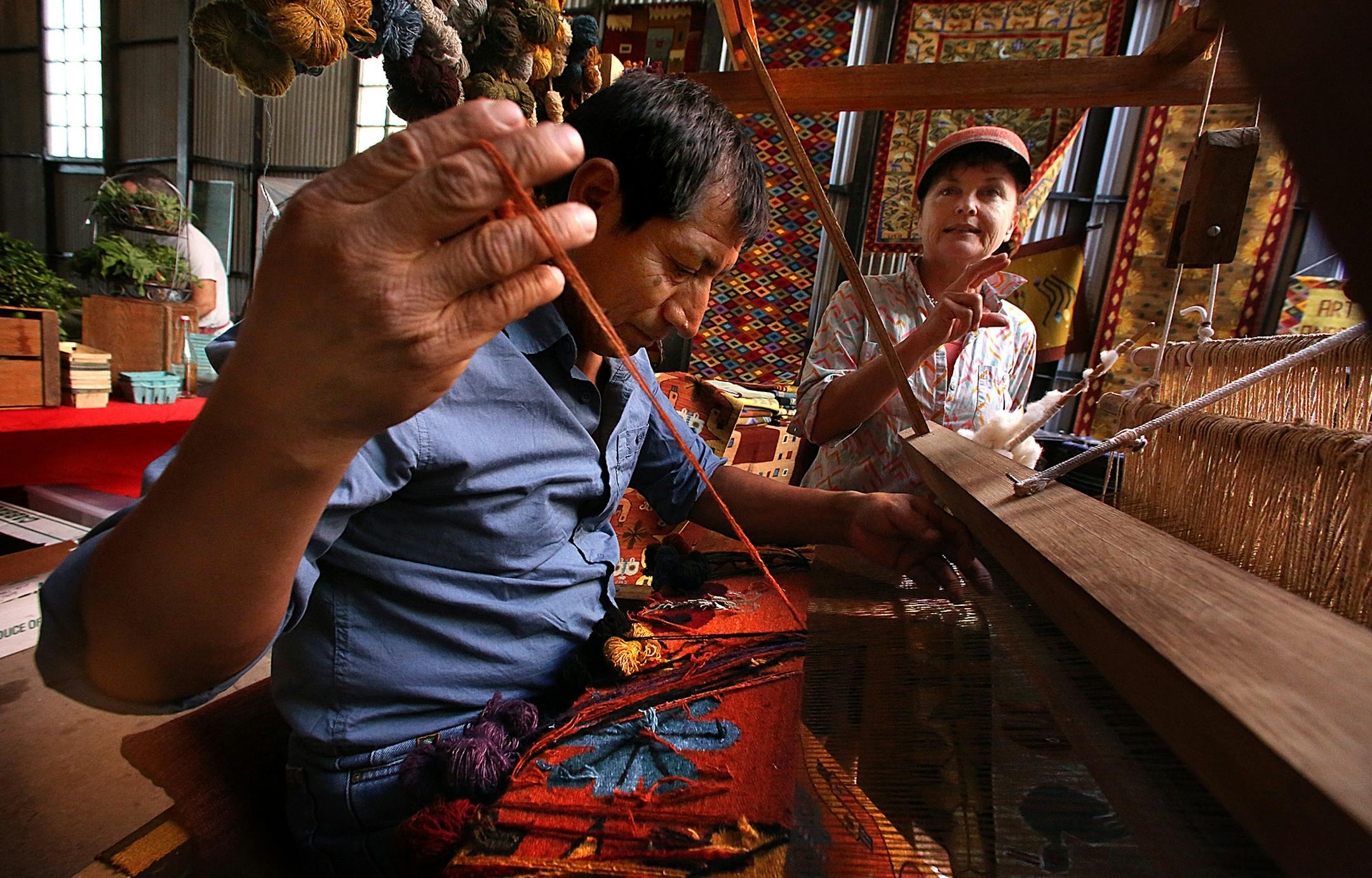 Wilbur Quispe and Melanie Ebertz demonstrated their weaving artistry to visitors at the Mill City Market. ]JIM GEHRZ ‚Ä¢ jgehrz@startribune.com / Minneapolis, MN / July 5, 2014 / 10:00 AM / BACKGROUND INFORMATION: FOR DUETS COLUMN