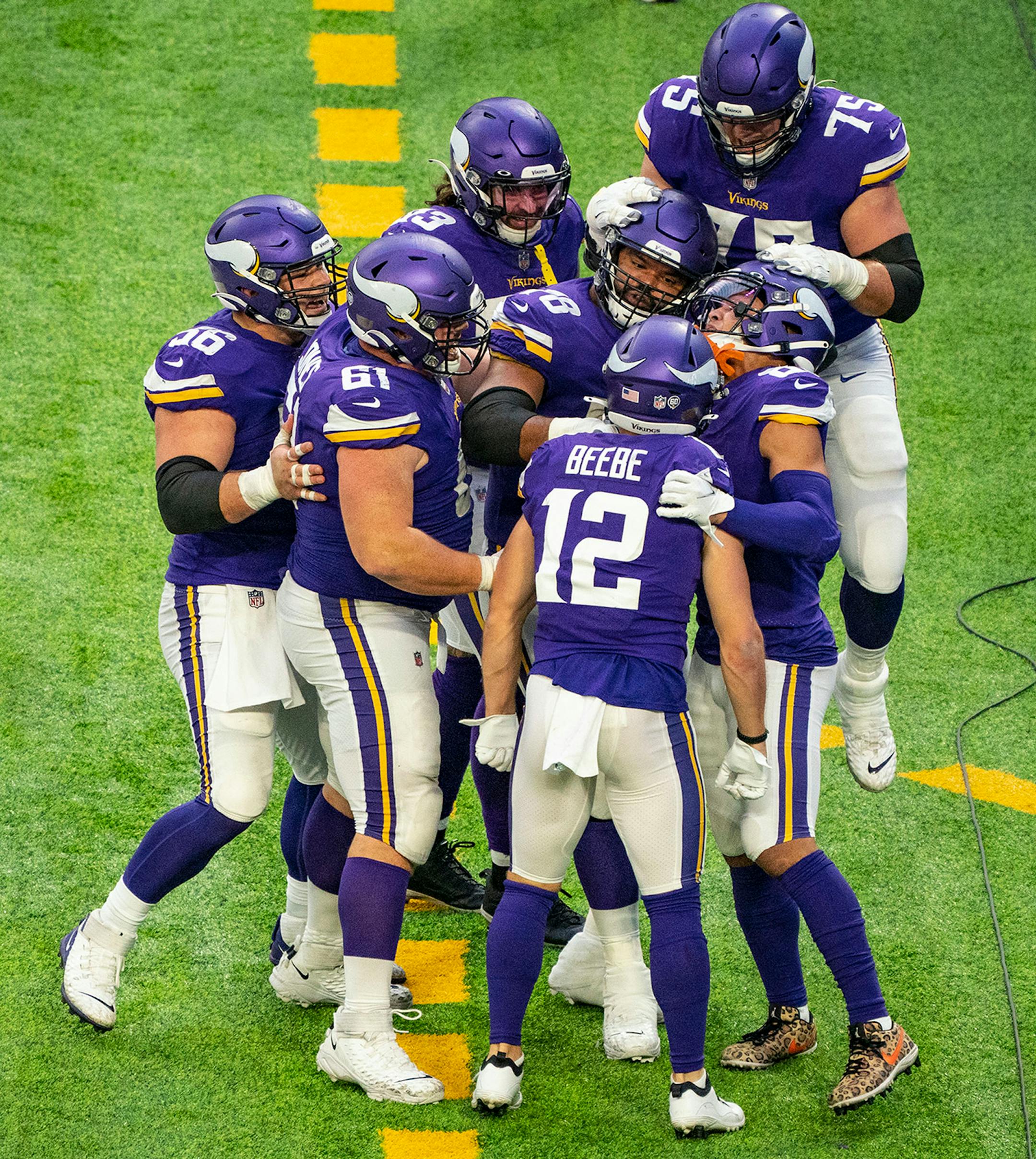 The Minnesota Vikings offense swarmed wide receiver Chad Beebe (12) after he scored the game winning touchdown with under a minute to play on Sunday.