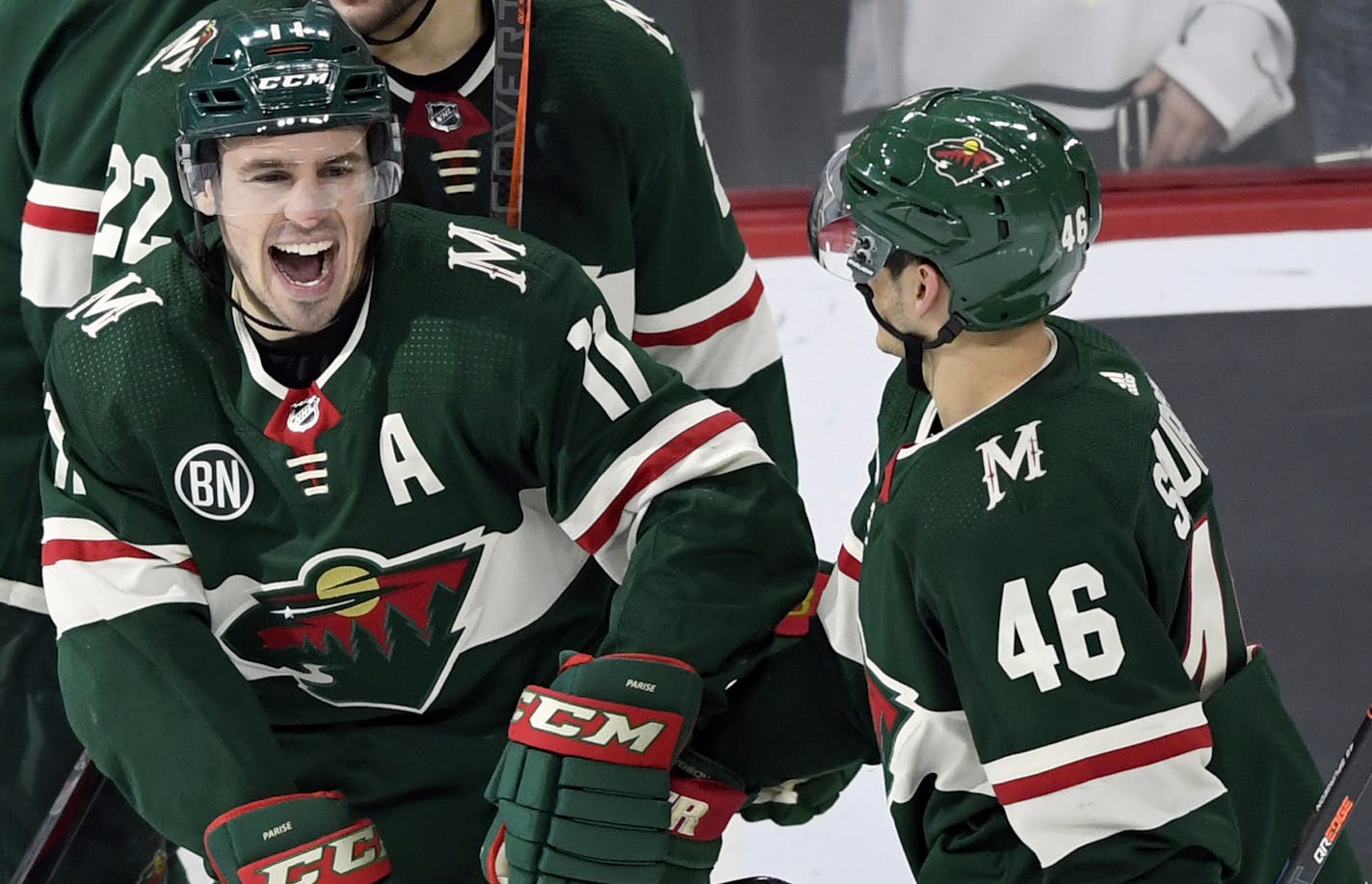 Minnesota Wild left wing Zach Parise (11) and defenseman Jared Spurgeon (46) celebrate a goal by Parise against the Florida Panthers during the third period of an NHL hockey game Thursday, Dec. 13, 2018, in St. Paul, Minn. The Wild won 5-1. (AP Photo/Hannah Foslien)