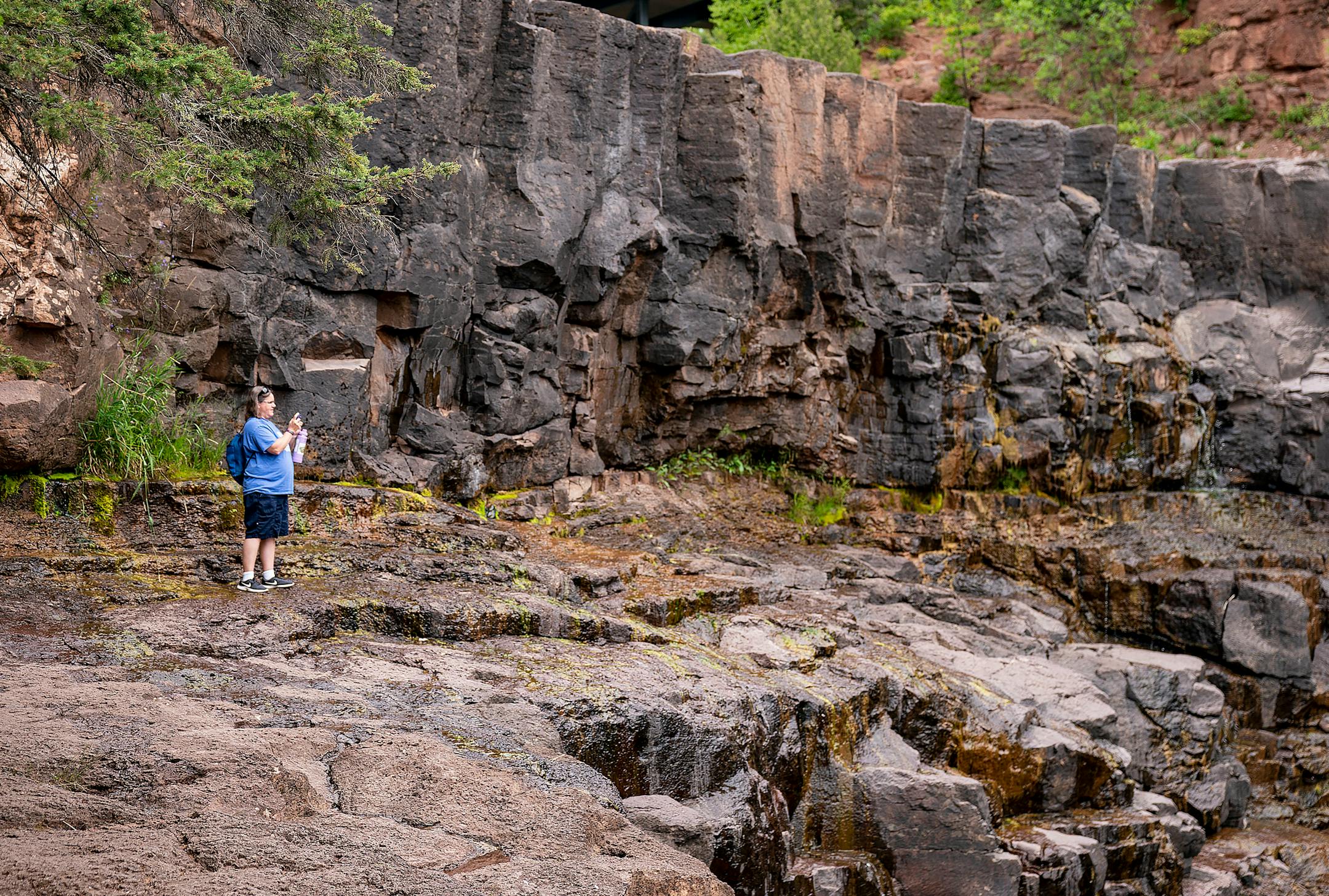 A visitor took a picture of the dried up western falls at Gooseberry Falls State Park on Wednesday, July 21, 2021. Sections of the falls have dried out because of the drought that has plagued the Midwest this summer.