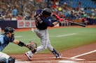 Minnesota Twins' Jorge Polanco hits a double to left agains the Tampa Bay Rays during the first inning of a baseball game Sunday, May 1, 2022, in St. 