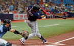 Minnesota Twins' Jorge Polanco hits a double to left agains the Tampa Bay Rays during the first inning of a baseball game Sunday, May 1, 2022, in St. 