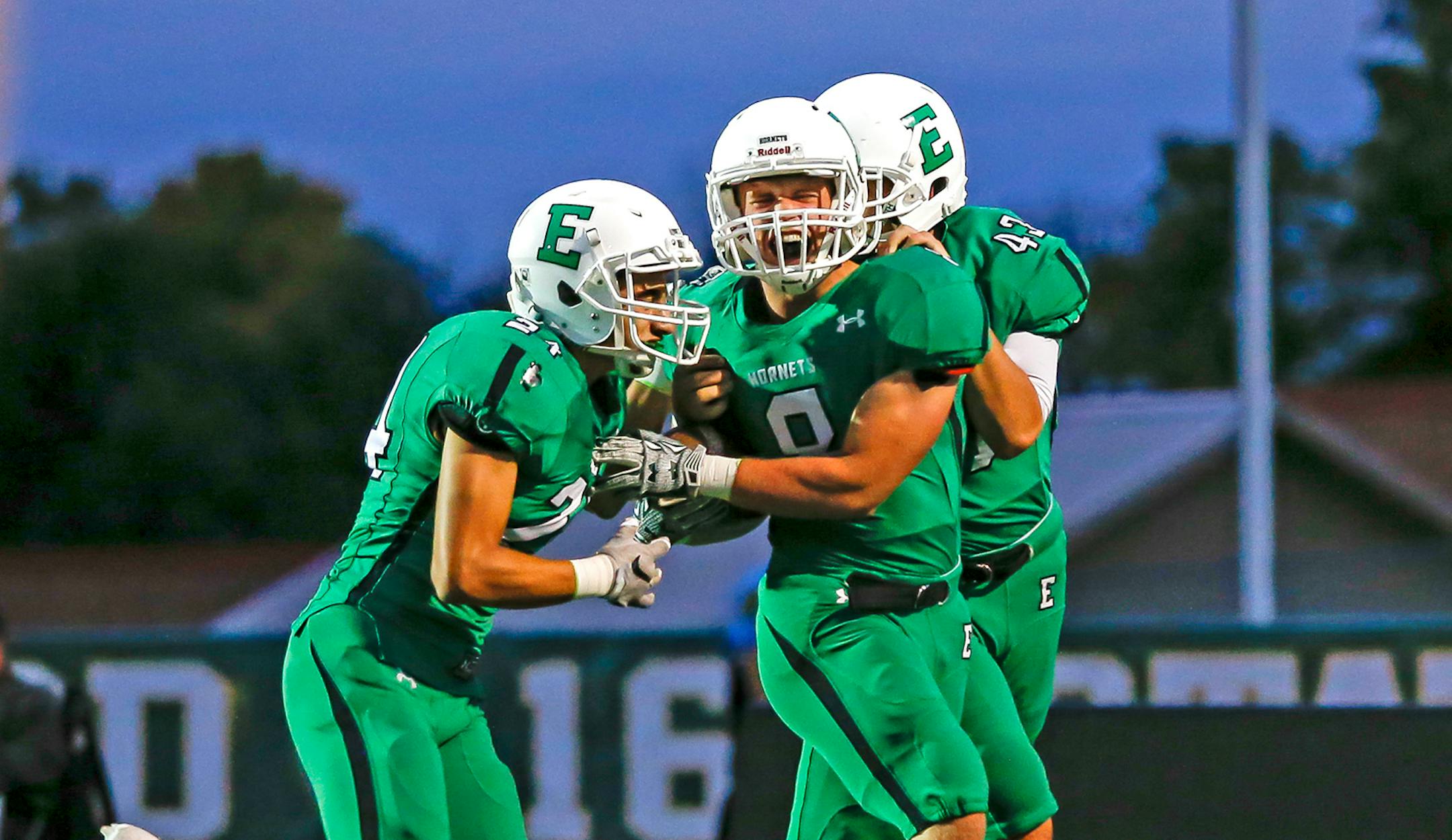Edina&#xed;s Nick Bloom (8) celebrated a touchdown on a punt return with teammates Eli Aaron (left) and Keishad Brookins (right) in the first half. Shakopee at Edina, football, 9-28-17. Photo by Mark Hvidsten, SportsEngine