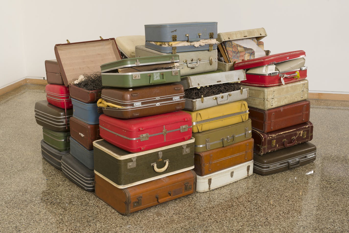 "Room 28" by Joel Ross, vintage suitcases, mixed media and found material.