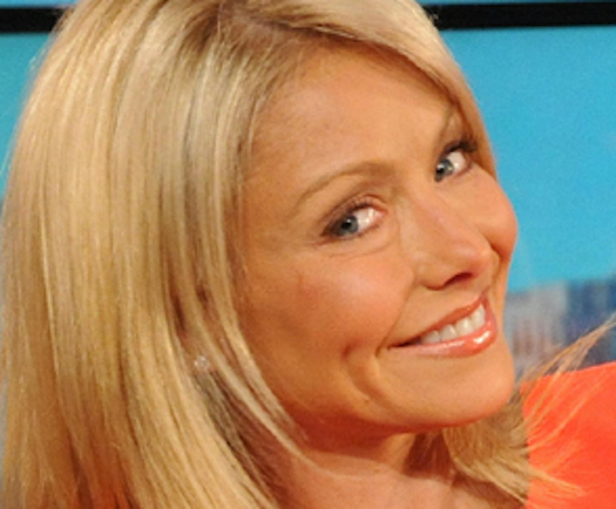 In this TV publicity image released by Disney-ABC Domestic Television, co-host Kelly Ripa, right, poses with her wax likeness which was debuted during a broadcast of "Live! with Regis and Kelly," Tuesday, April 5, 2011 in New York. The wax figure will be displayed at Madame Tussauds New York. (AP Photo/Disney-ABC Domestic Television)
