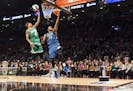 Minnesota Timberwolves' Karl-Anthony Towns (32) and Boston Celtics' Isaiah Thomas compete during the NBA all-star skills competition in Toronto on Sat