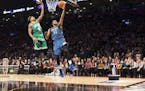 Minnesota Timberwolves' Karl-Anthony Towns (32) and Boston Celtics' Isaiah Thomas compete during the NBA all-star skills competition in Toronto on Sat