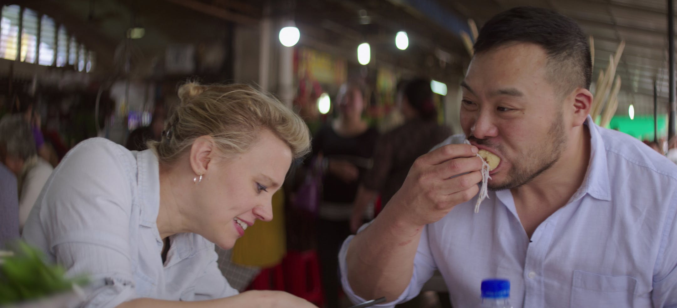 Breakfast, Lunch & Dinner - Season 1 David Chang and Kate McKinnon trying street food in Phnom Penh
credit: Netflix