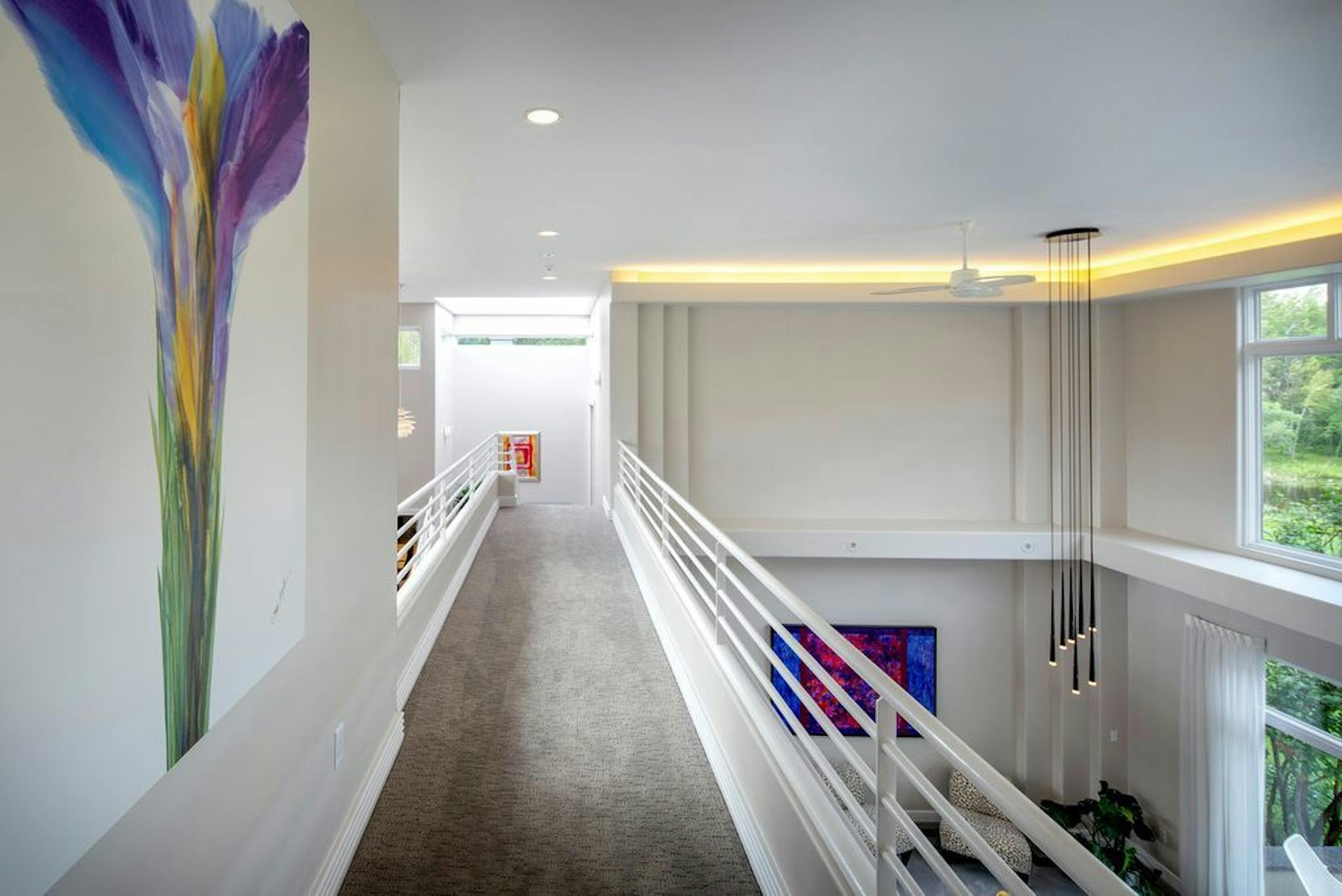 The catwalk connects the second-floor master bedroom with two other bedrooms.