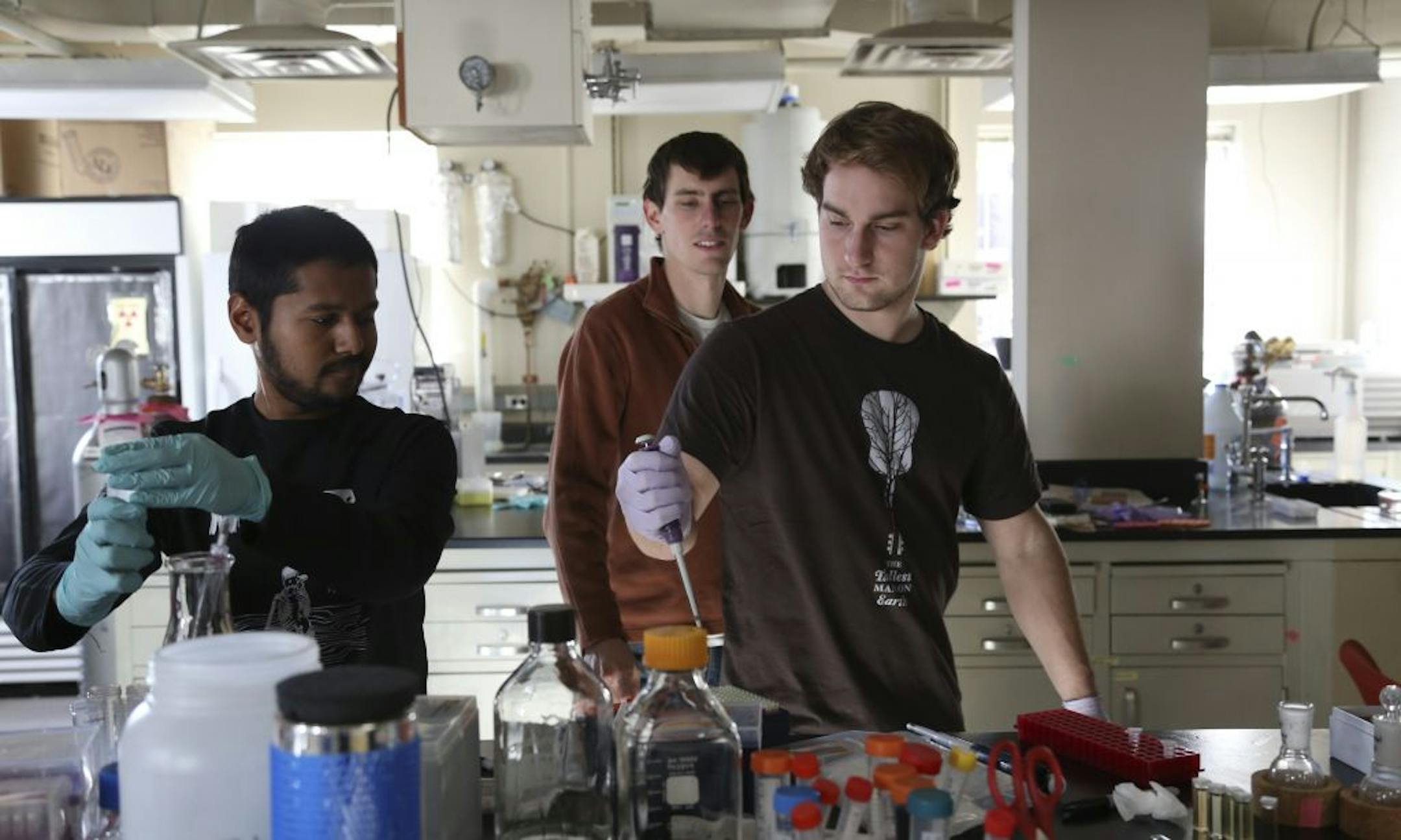 Graduate students Maroof Adil , Tim Pearce, and Zach Erdman worked on their related projects in the associate professor's Efie Kokkoli research group work in one of the labs at Amundson Hall at the University of Minnesota in Minneapolis, Min., Wednesday October 31, 2012. Bob Gore inventor of Gore-Tex gave $10 million for expansion of the hall that houses the chemical engineering program