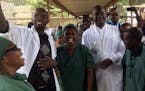 Denis Mukwege, center, celebrates with his staff after learning he has been awarded the 2018 Nobel Peace Prize, at the Panzi hospital in Bukavu, easte