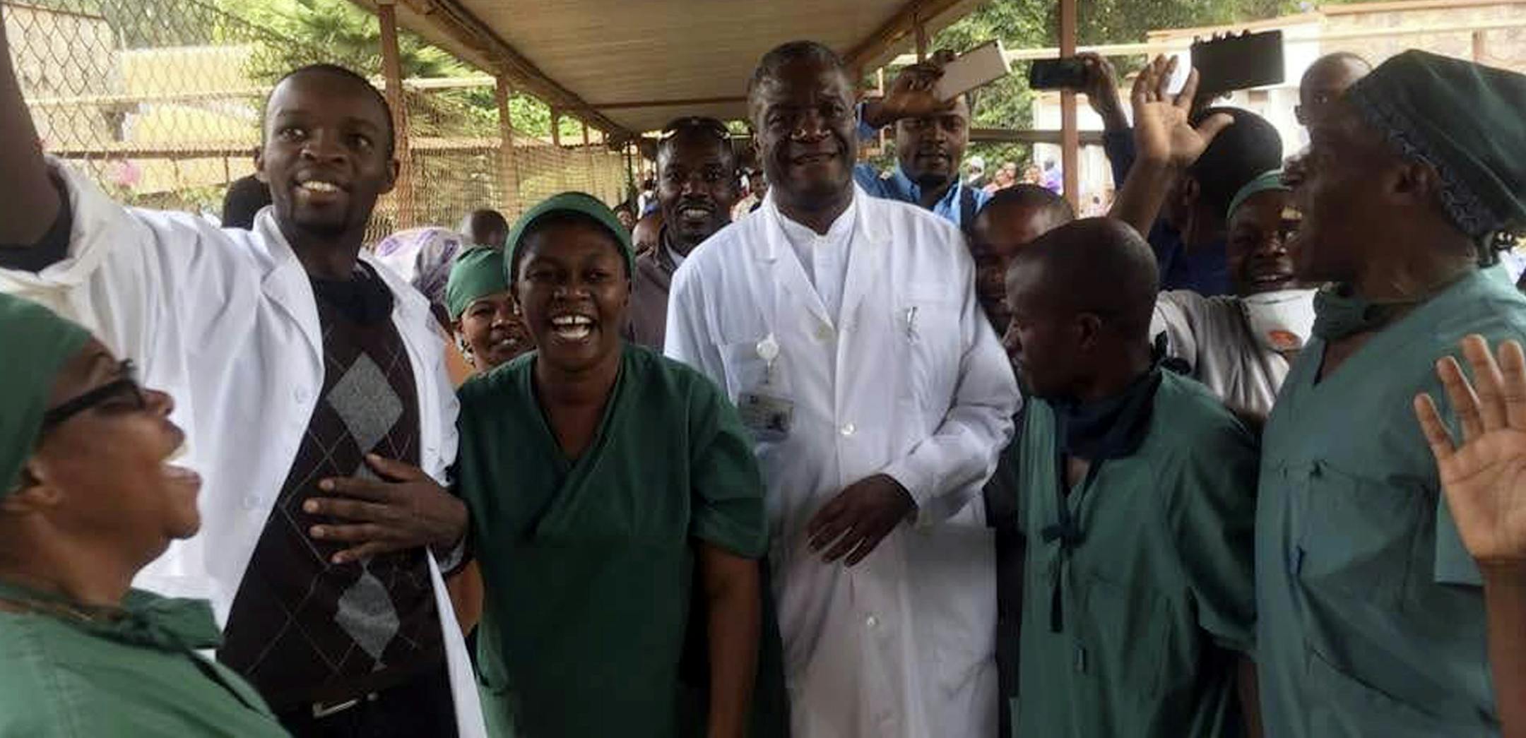Denis Mukwege, center, celebrates with his staff after learning he has been awarded the 2018 Nobel Peace Prize, at the Panzi hospital in Bukavu, eastern Congo, Friday, Oct. 5, 2018. Mukwege, 63, founded the hospital and has treated thousands of women, many of whom were victims of gang rape. Armed men tried to kill him in 2012, forcing him to temporarily leave the country. "The importance of Dr. Mukwege's enduring, dedicated and selfless efforts in this field cannot be overstated. He has repeated