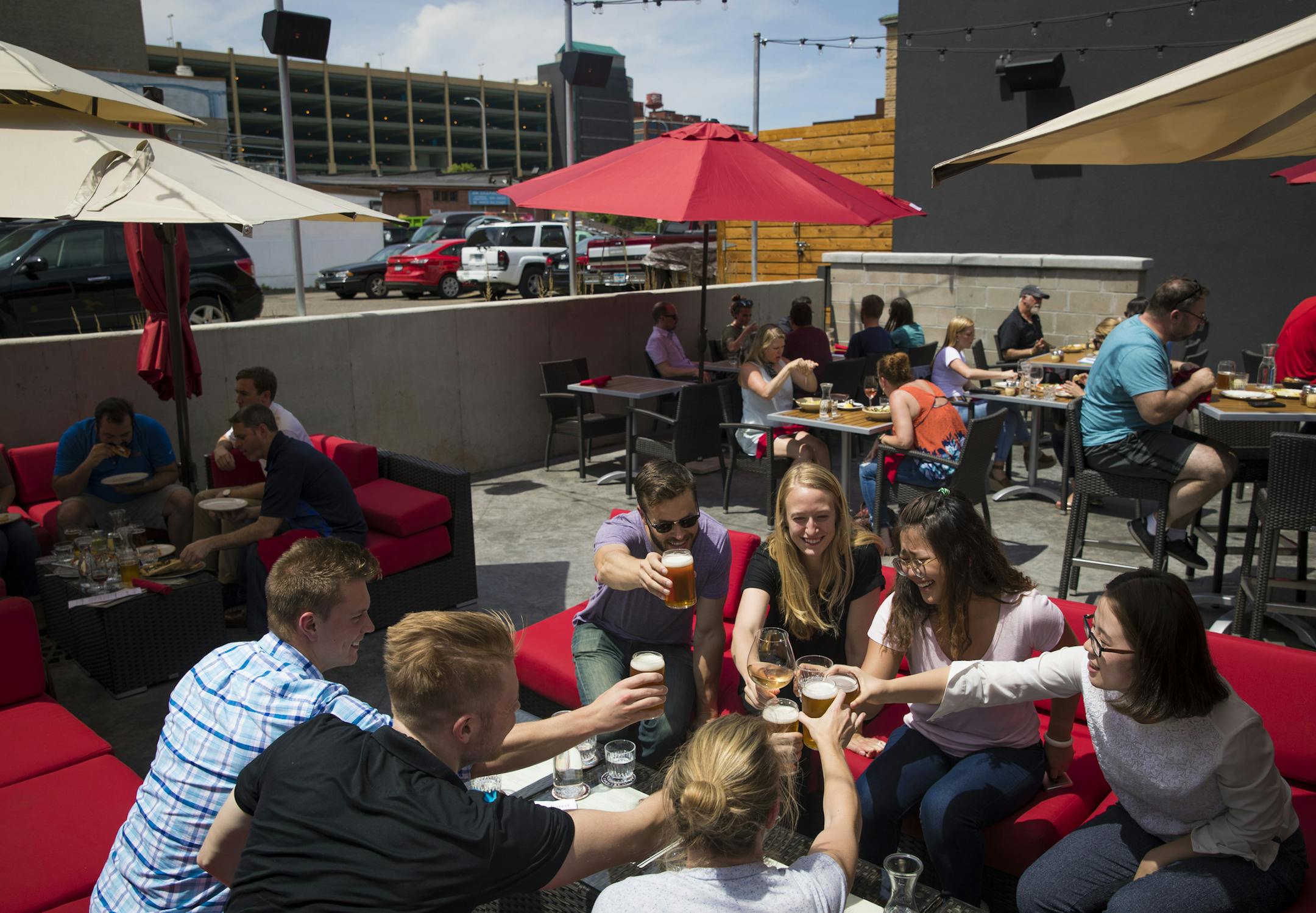 Colleagues from Worrell made a toast on the patio at the Red Rabbit in Minneapolis, Minn., on Friday, June 16, 2017. ] RENEE JONES SCHNEIDER • renee.jones@startribune.com