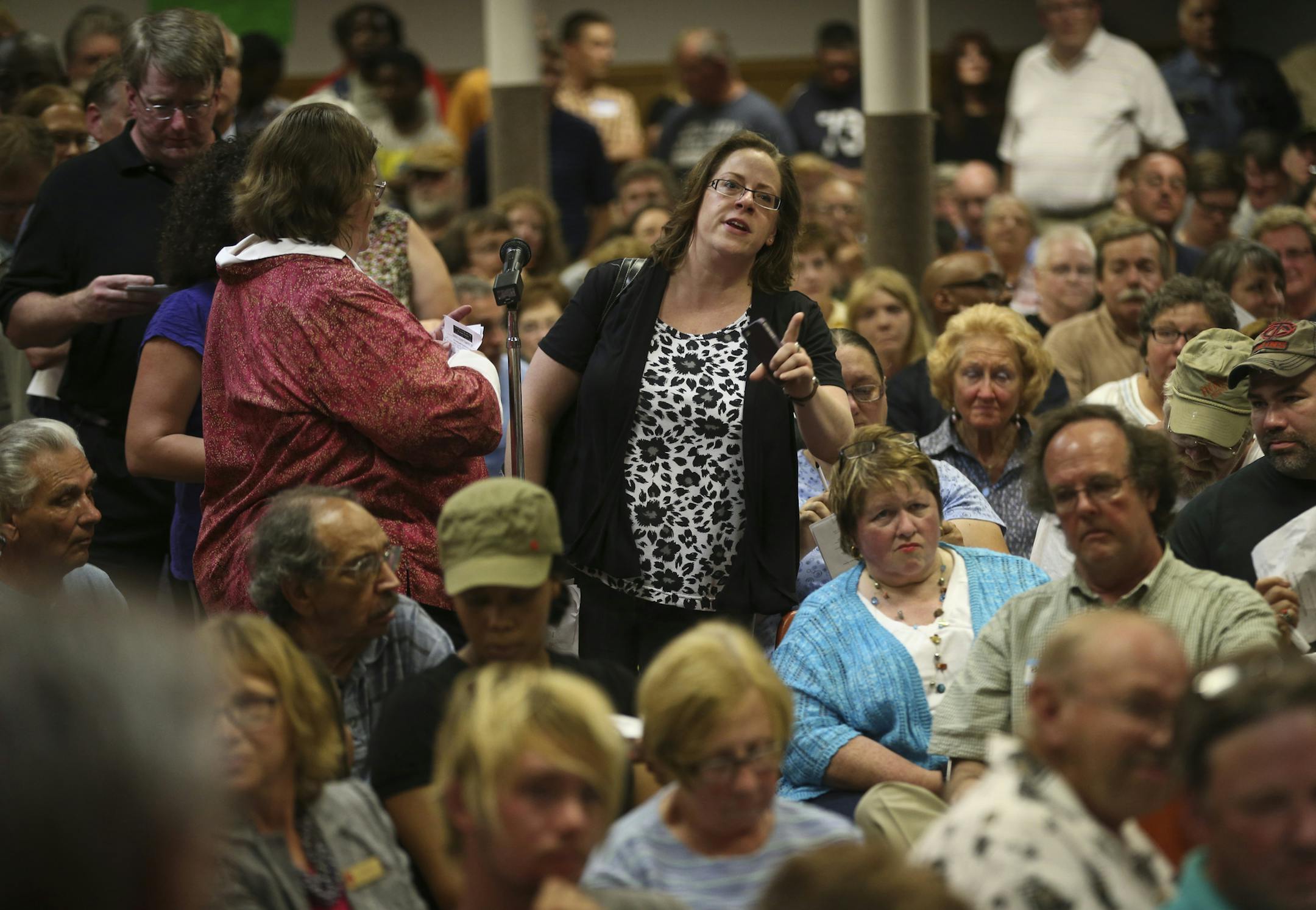 A woman, who referred to herself as “Jean,” became angry with what she considered a statement by police officers instead of an answer as she brought up questions about acts of violence.