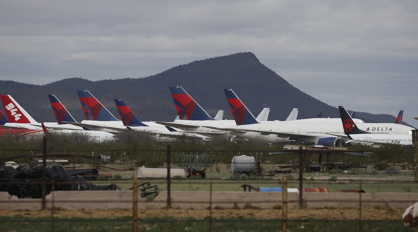 Tail fins of Delta Air Lines planes at Pinal Airpark, in Red Rock, Ariz., as many passenger planes are being kept at the facility as airlines cut back on service due to the coronavirus COVID-19 pandemic.