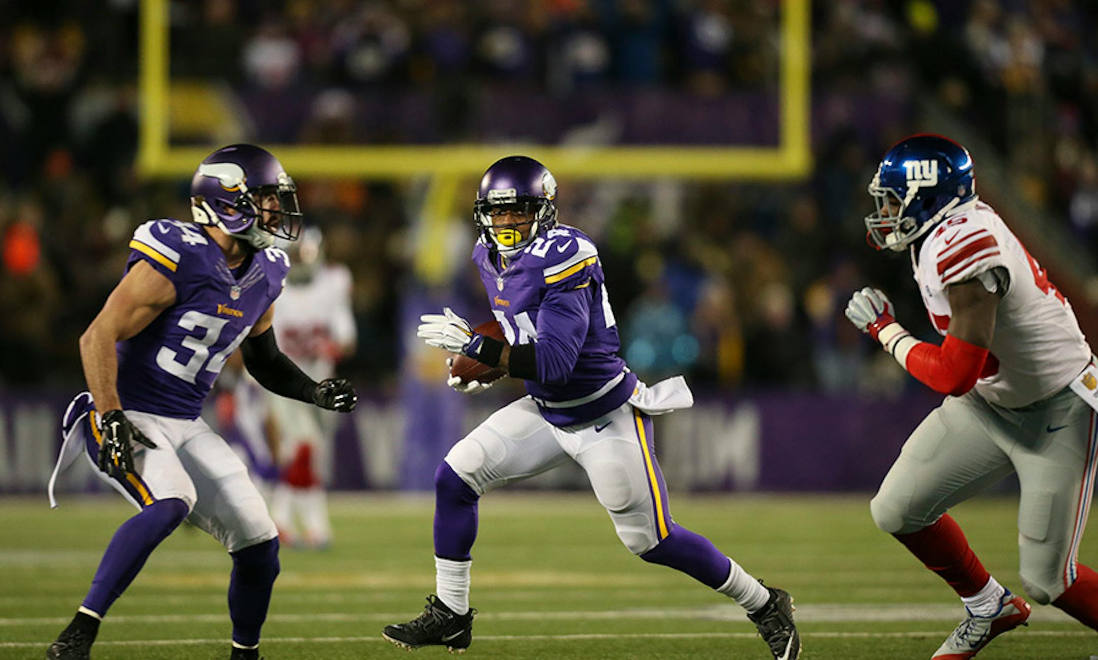 Vikings cornerback Captain Munnerlyn (24) looked for daylight after intercepting a pass in the third quarter Sunday night. He returned it for 32 yards, setting up a Vikings TD.