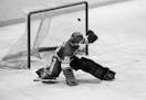 FILE - In this 1980 file photo, Soviet goalie Vladislav Tretiak allows a goal by the U.S. team in the first period of a medal-round hockey game at the