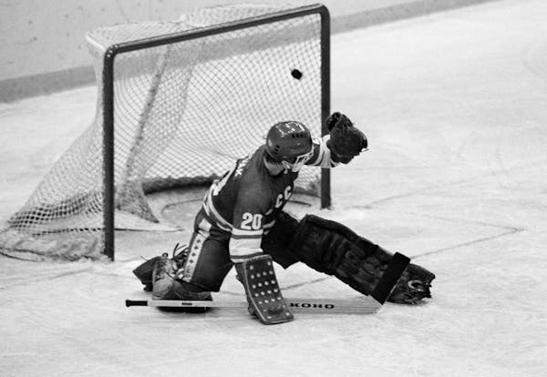 FILE - In this 1980 file photo, Soviet goalie Vladislav Tretiak allows a goal by the U.S. team in the first period of a medal-round hockey game at the
