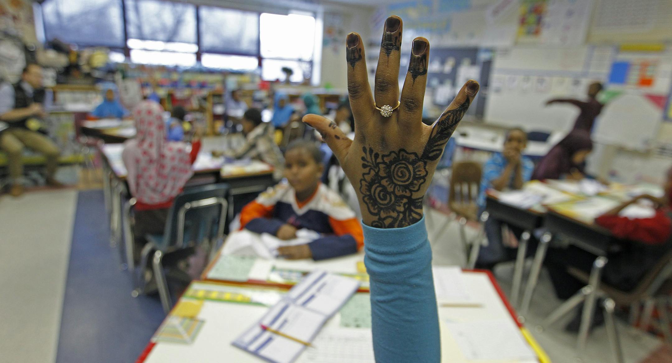 Fartun Jama held up her decorated hand to answer questions during James Kindle's class, Wednesday, January 22, 2014 in Minneapolis, MN. (ELIZABETH FLORES/STAR TRIBUNE) ELIZABETH FLORES &#x2022; eflores@startribune.com