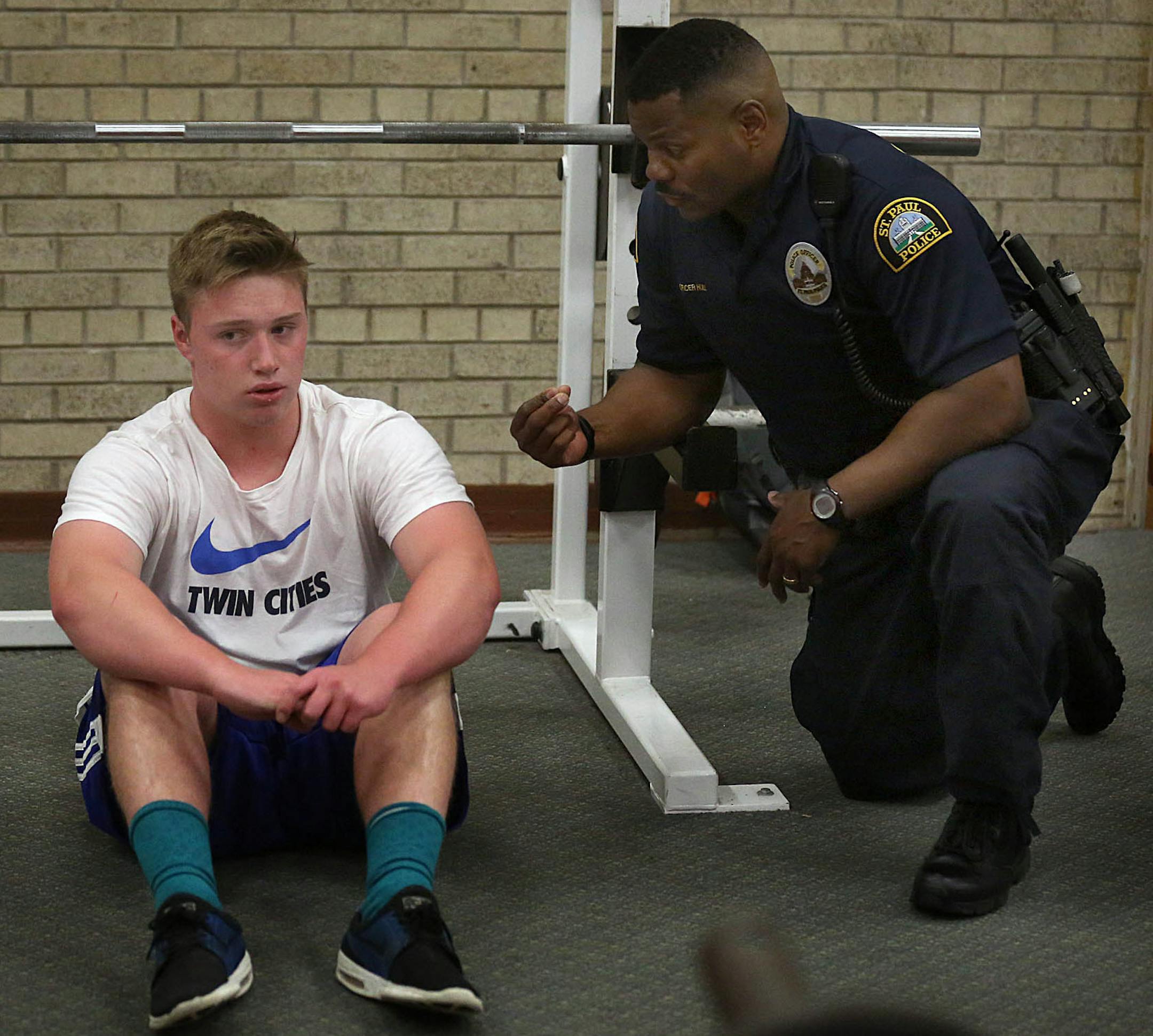 Cortez Hull, school resource officer (SRO) at Highland Park High School in St. Paul, talked with freshman Peyton Haider, 15, about weight lifting after school. ] JIM GEHRZ &#xef; james.gehrz@startribune.com / St. Paul, MN / June 8, 2016 3:00 PM &#xf1; BACKGROUND INFORMATION: Recent events have brought sharp contrasts in how school resource officers -- cops in the schools -- are viewed locally, and their future in two of the state's largest districts is a matter now up for debate. In St. Paul, di