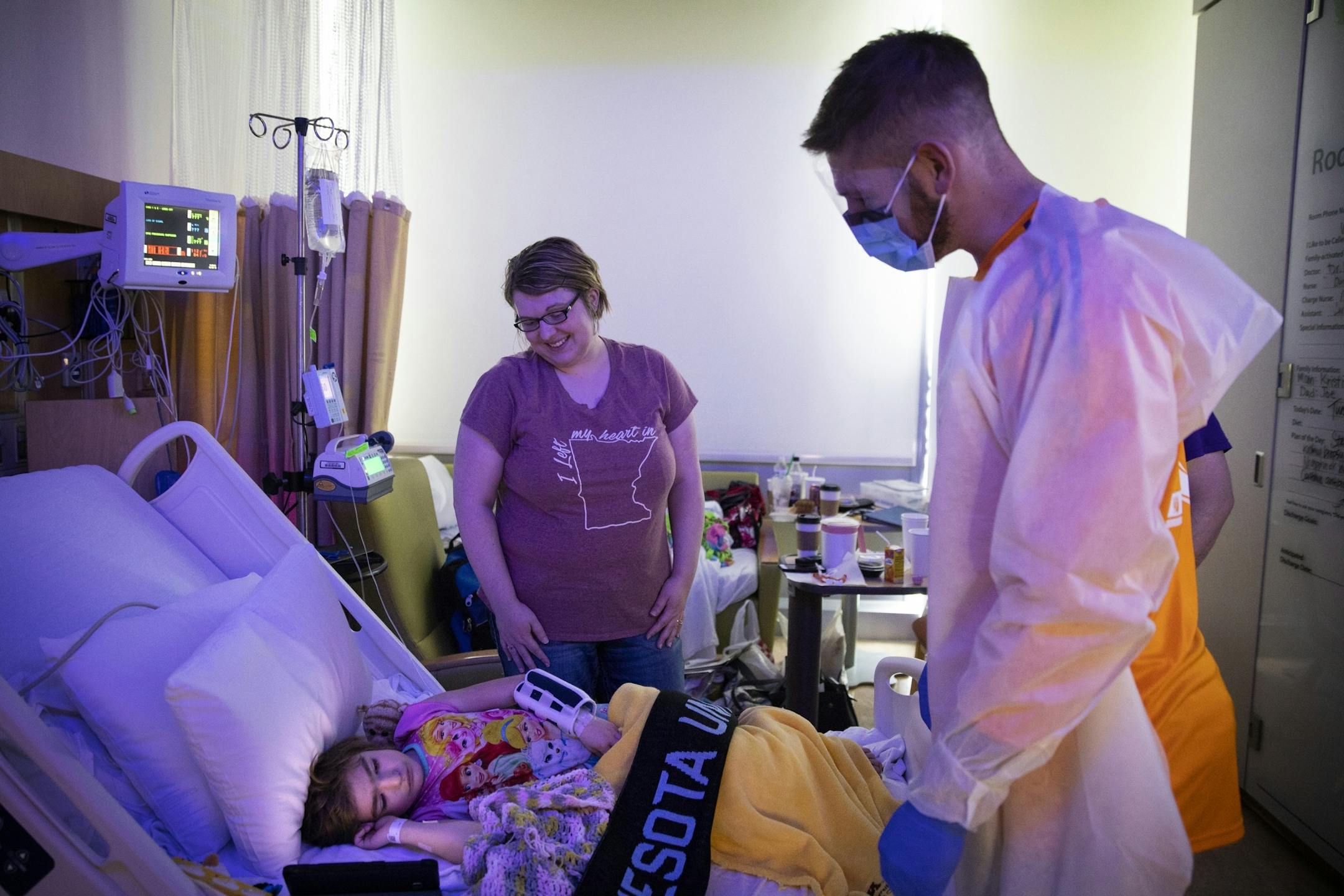Minnesota United goalkeeper Matt Lampson visits with Addison Weber, 6, who has recently gotten a kidney transplant, with her mother Kristi Naber.