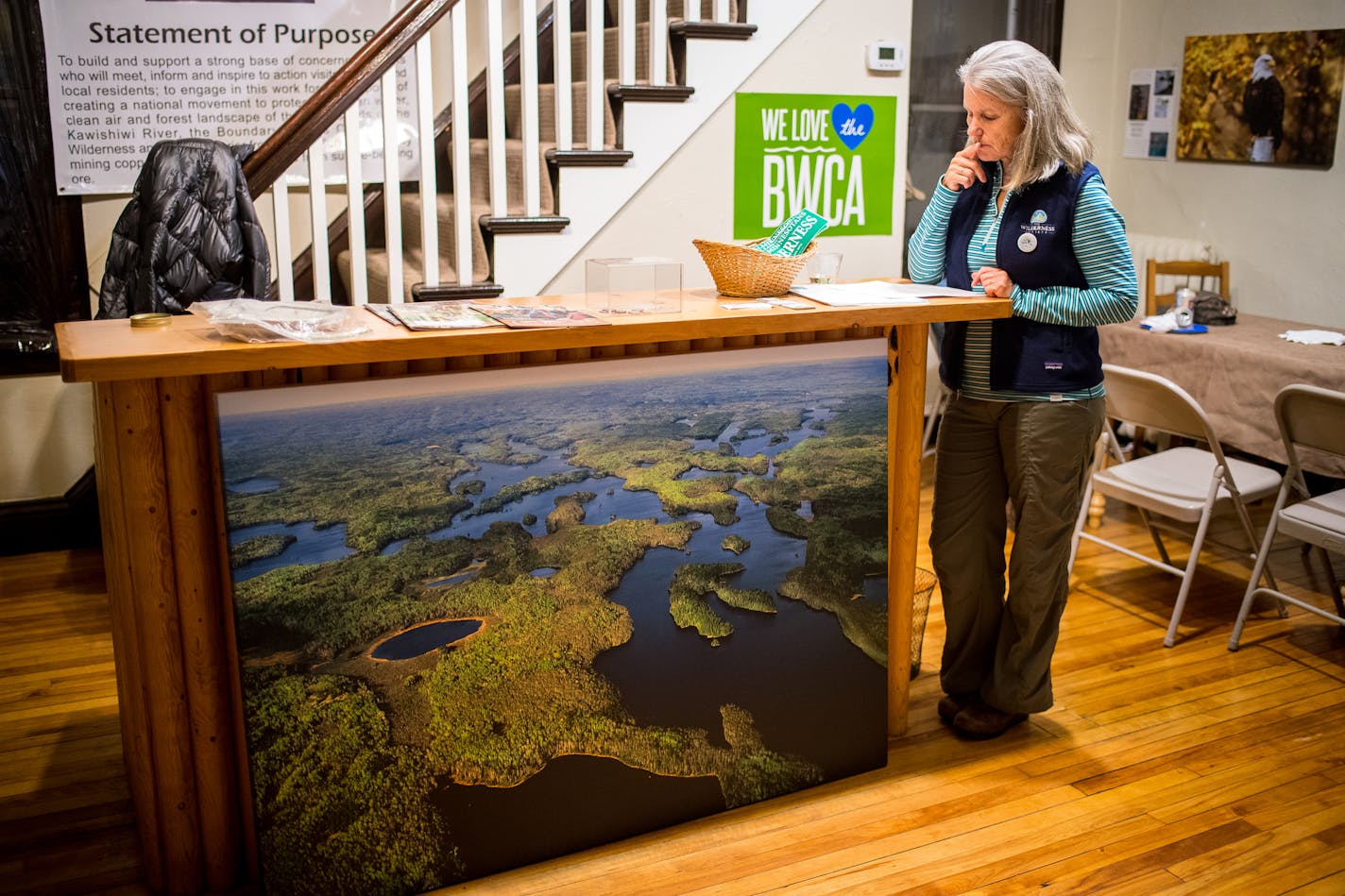 Becky Rom read through her notes before speaking to a group of fellow environmentalists at the Save the Boundary Waters office in downtown Ely Thursday night. ] (AARON LAVINSKY/STAR TRIBUNE) aaron.lavinsky@startribune.com Profile on BWCA environmental activist Becky Rom, who is fighting proposed sulfide ore copper mining near the edge of the BWCA. Photographed Thursday, Nov. 10, 2016 in Ely, Minn.