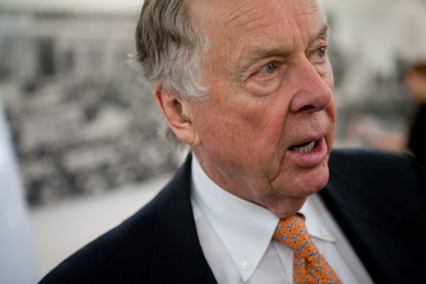 WASHINGTON - JANUARY 13: T. Boone Pickens speaks to a member of the audience after hosting an energy policy briefing with Robert F. Kennedy Jr. at the United States Capitol on January 13, 2009 in Washington, D.C. Pickens and Kennedy advocate moving the American economy away from foreign sources of oil and reducing carbon emissions.