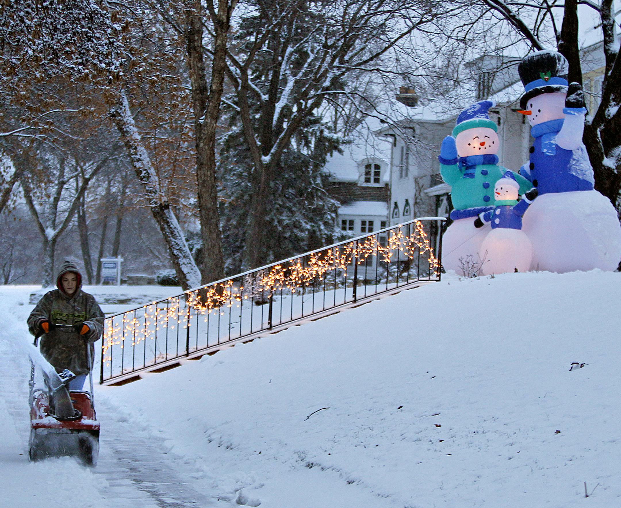 Many had their snowblowers running to deal with the snow this week, including Jessica Bellcourt, (Wednesday, December 4, 2013 in Minneapolis.)