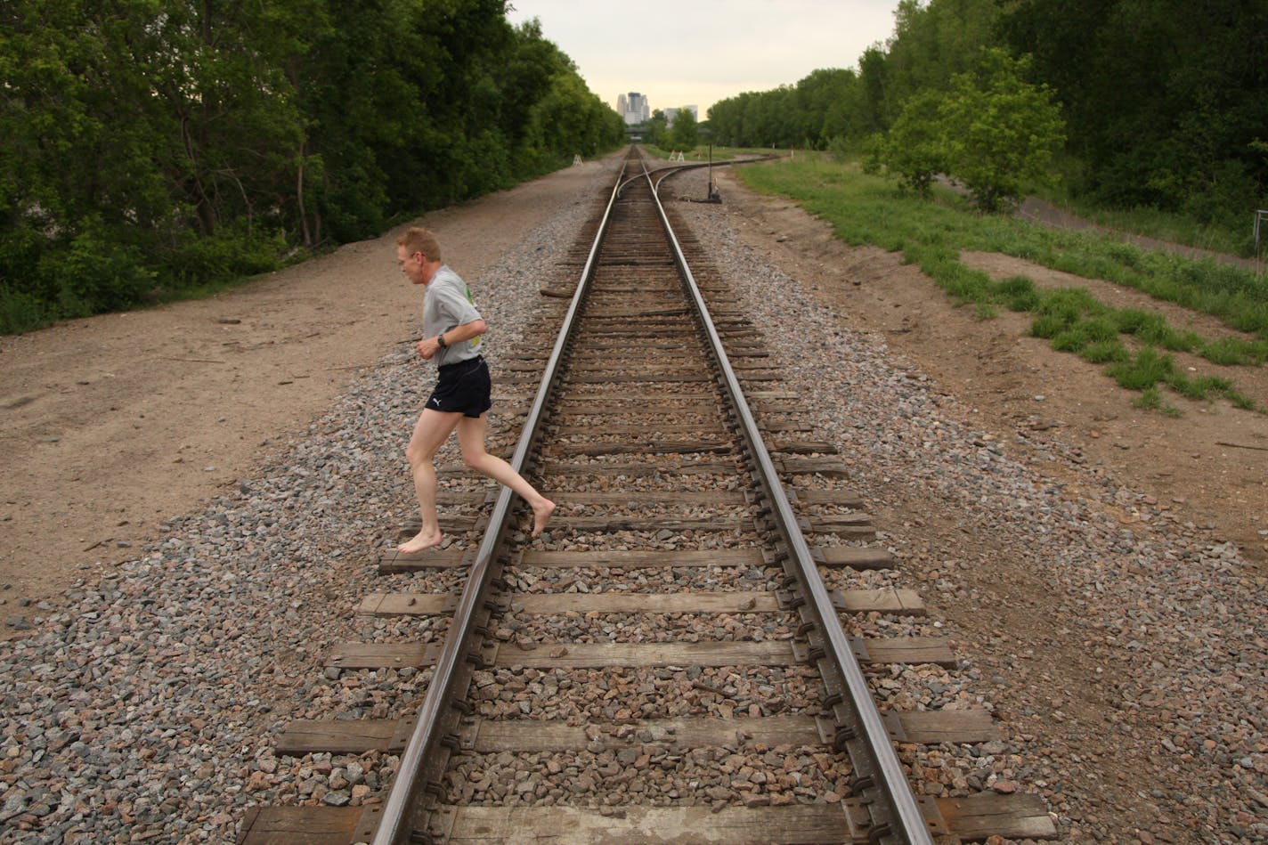 Dean Laiti gingerly crossed the railroad tracks on his way back from a run near Cedar Lake in Minneapolis Tuesday evening.