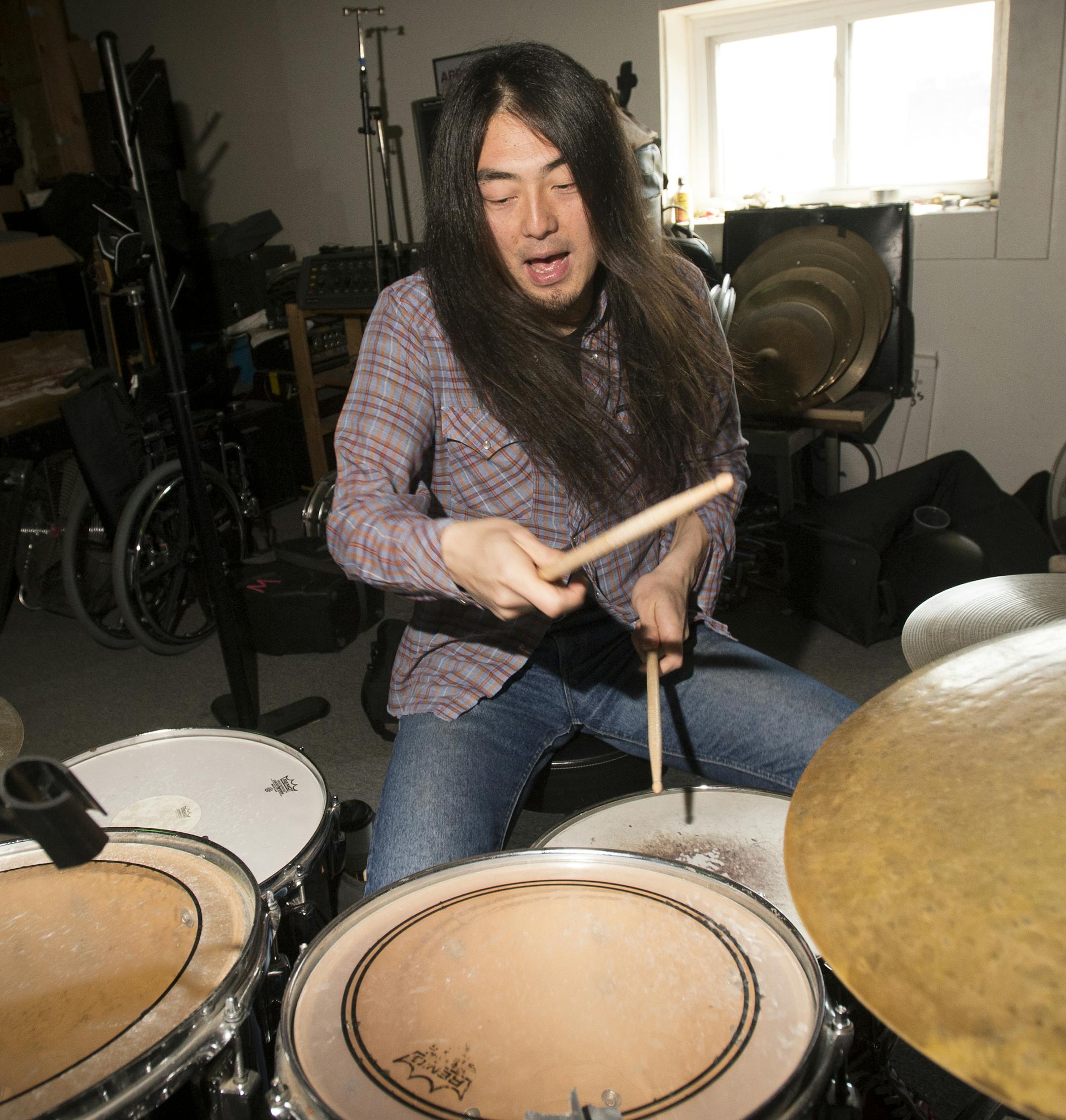 Birthday Suits drummer, Matthew Kazama, practices with singer and guitarist Hideo Takahashi, not pictured, on Saturday afternoon. ] (Aaron Lavinsky | StarTribune) aaron.lavinsky@startribune.com Singer and guitarist Hideo Takahashi and drummer Matthew Kazama, of Twin Cities punk band, the Birthday Suits, practice on Saturday, April 25, 2015 at a rehearsal space in Logan Park.