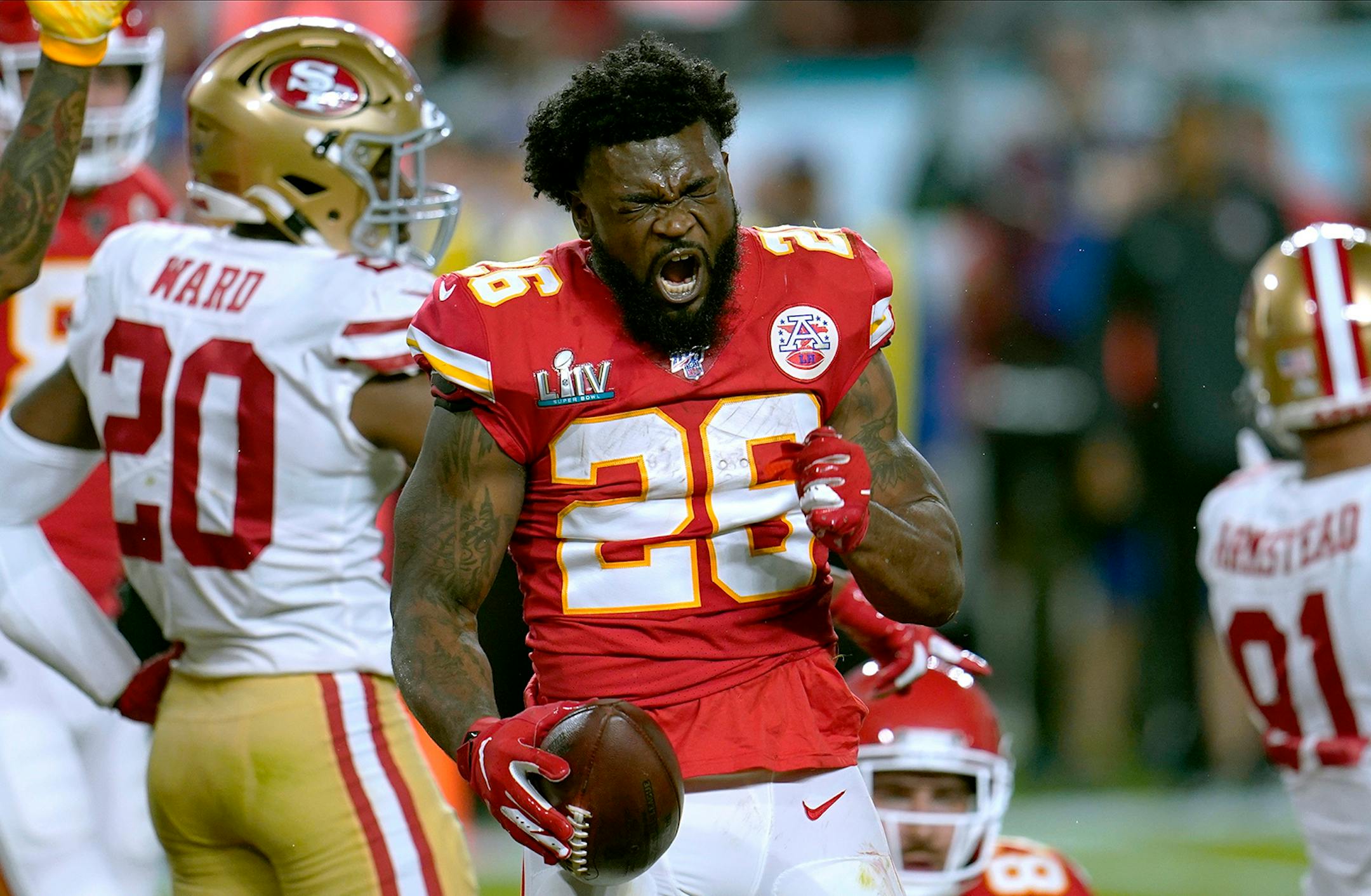 Kansas City Chiefs running back Damien Williams celebrates after a run against the San Francisco 49ers during the first half of the NFL Super Bowl 54 football game Sunday, Feb. 2, 2020, in Miami Gardens, Fla.