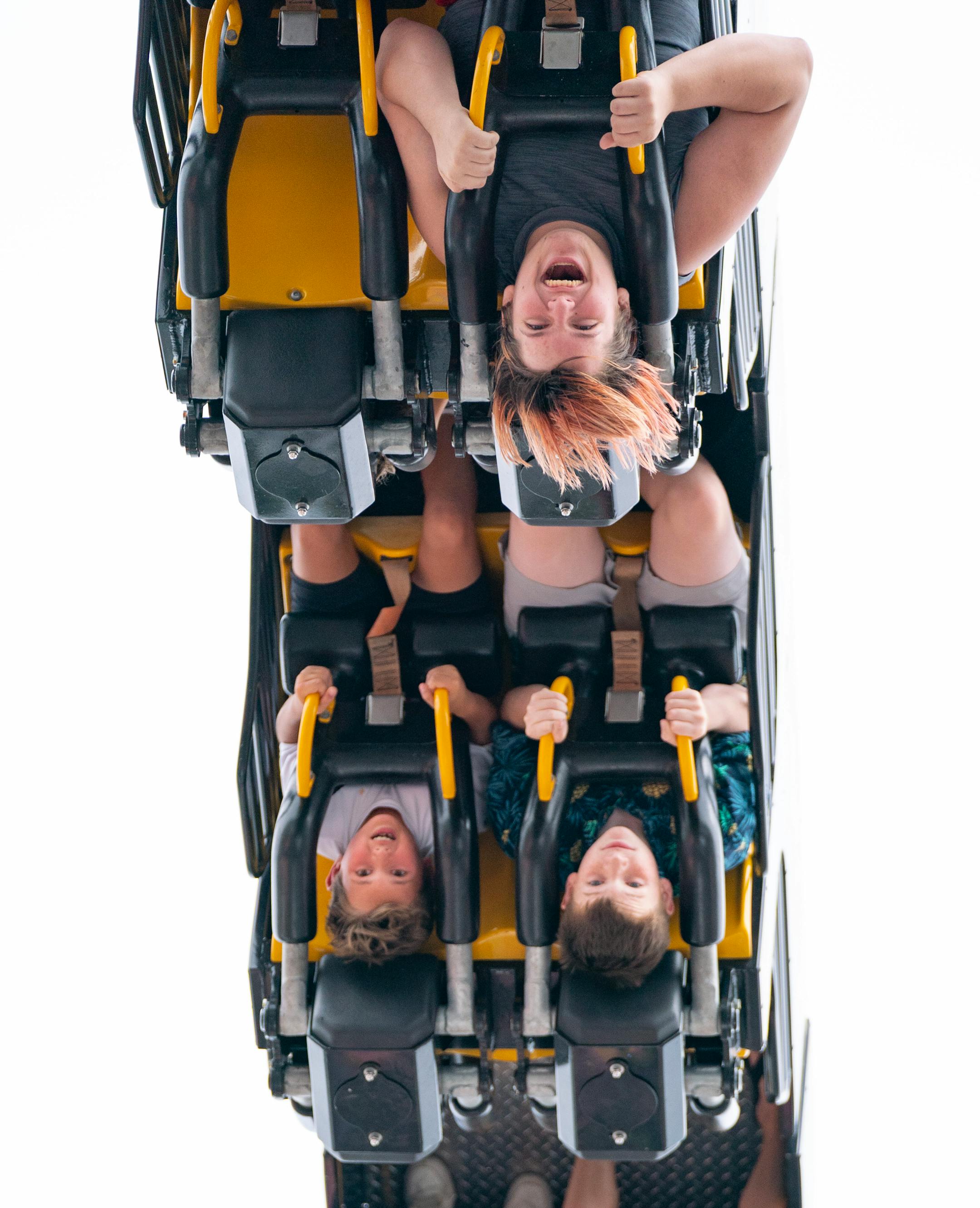 Alex Robinson, 15, laughs as he rides the rollercoaster "Infinity".