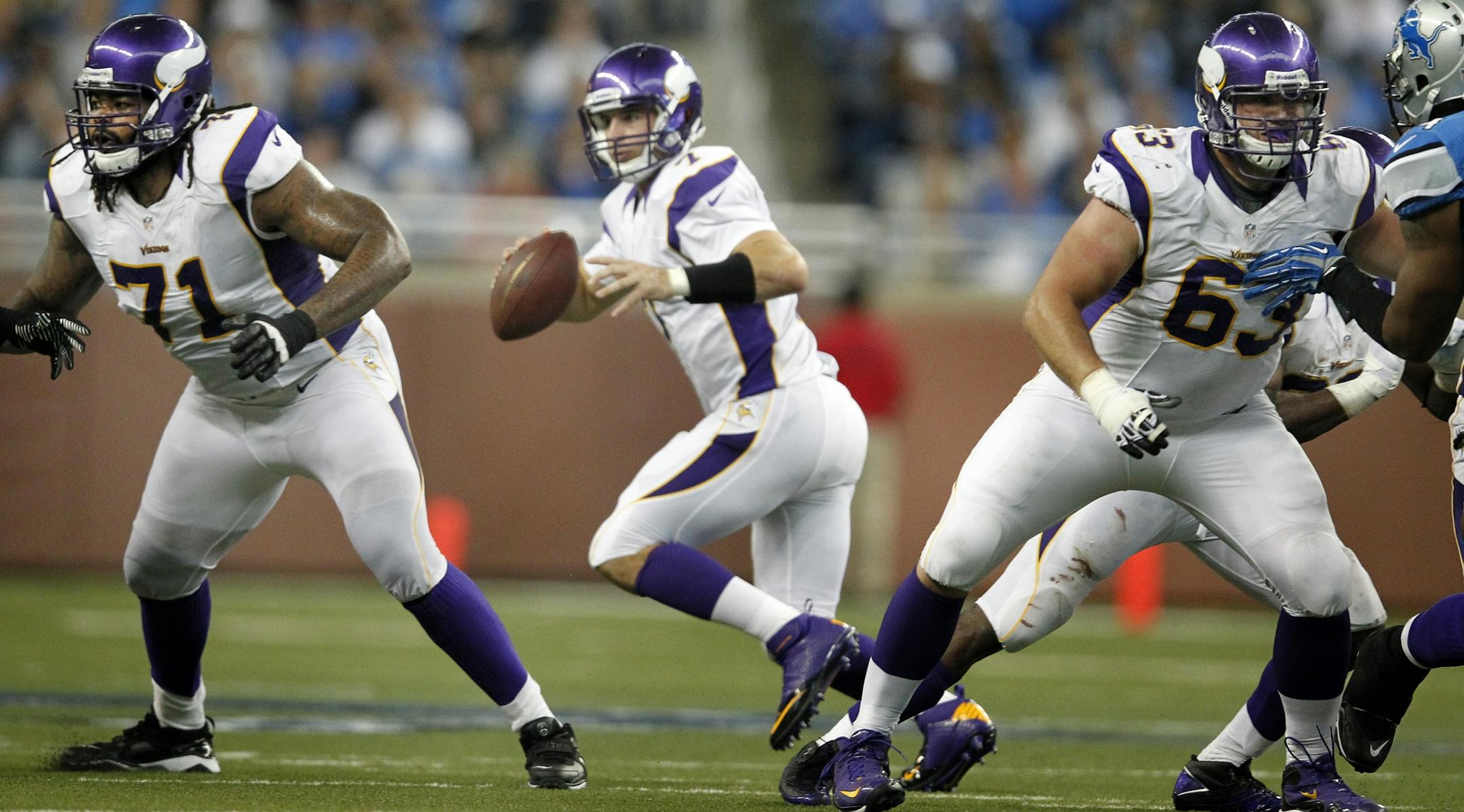Minnesota Vikings offensive lineman Phil Loadholt (71) and Brandon Fusco (63) protected quarterback Christian Ponder (7).