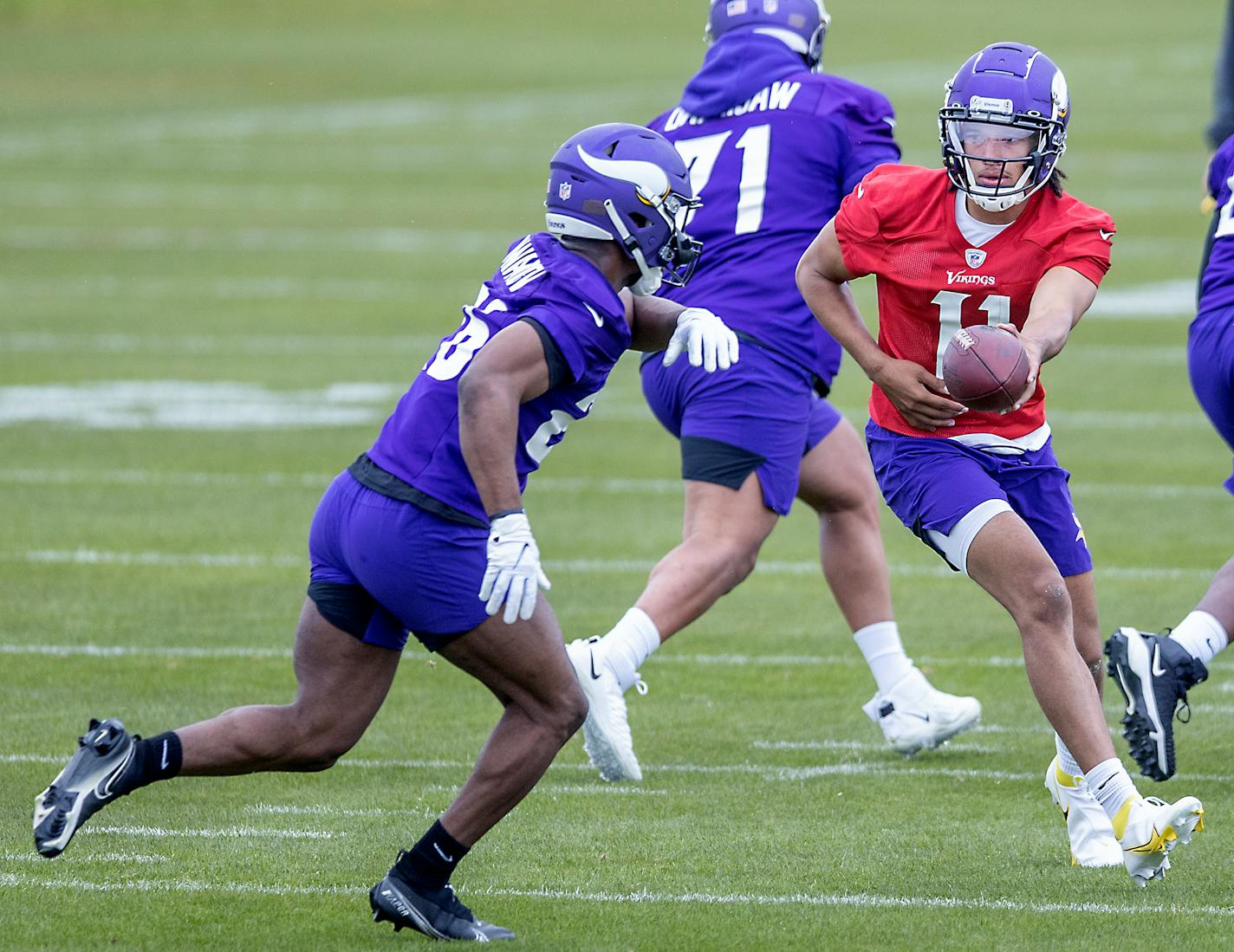 Minnesota Vikings rookies, including quarterback Kellen Mond, right, practice during NFL football rookie minicamp Friday, May 14, 2021, in Eagan, Minn. (Elizabeth Flores/Star Tribune via AP)