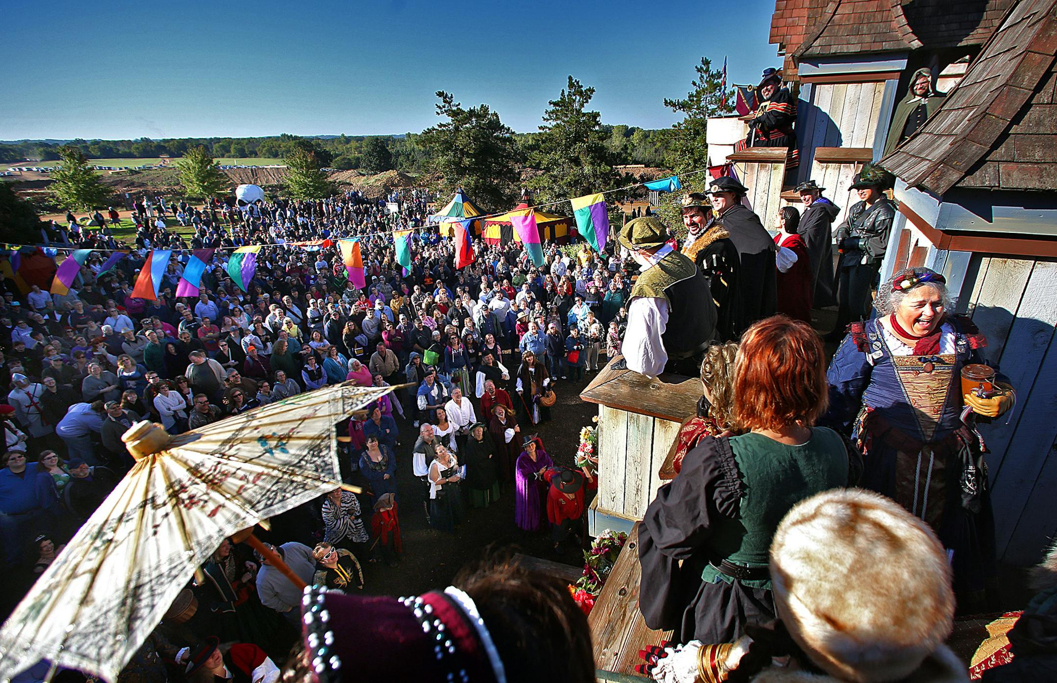 A large crowd gathered outside the King&#x201a;&#xc4;&#xf4;s Gate to watch a brief program at the Renaissance Festival, prior to the start of a new day. ] JIM GEHRZ &#x201a;&#xc4;&#xa2; jgehrz@startribune.com / Shakopee, MN / Sept. 13, 2014 / 8:30 AM / BACKGROUND INFORMATION: For decades the Renaissance Festival has been trying to maintain an illusion of a return to a distant medieval past. But recent patrons report that the illusion is under strain, as a very modern-day enterprise, sand mining
