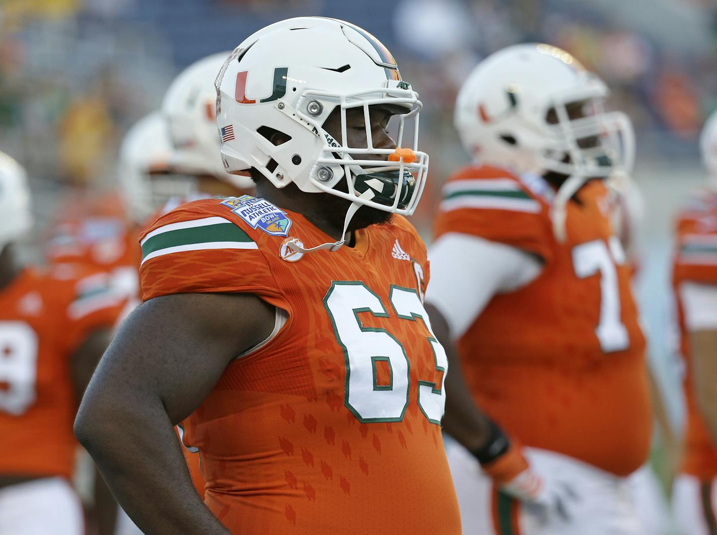 Miami offensive lineman Danny Isidora (63) warms up before the first half of the Russell Athletic Bowl NCAA college football game against West Virginia, Wednesday, Dec. 28, 2016, in Orlando, Fla. (AP Photo/John Raoux) ORG XMIT: FLJR1