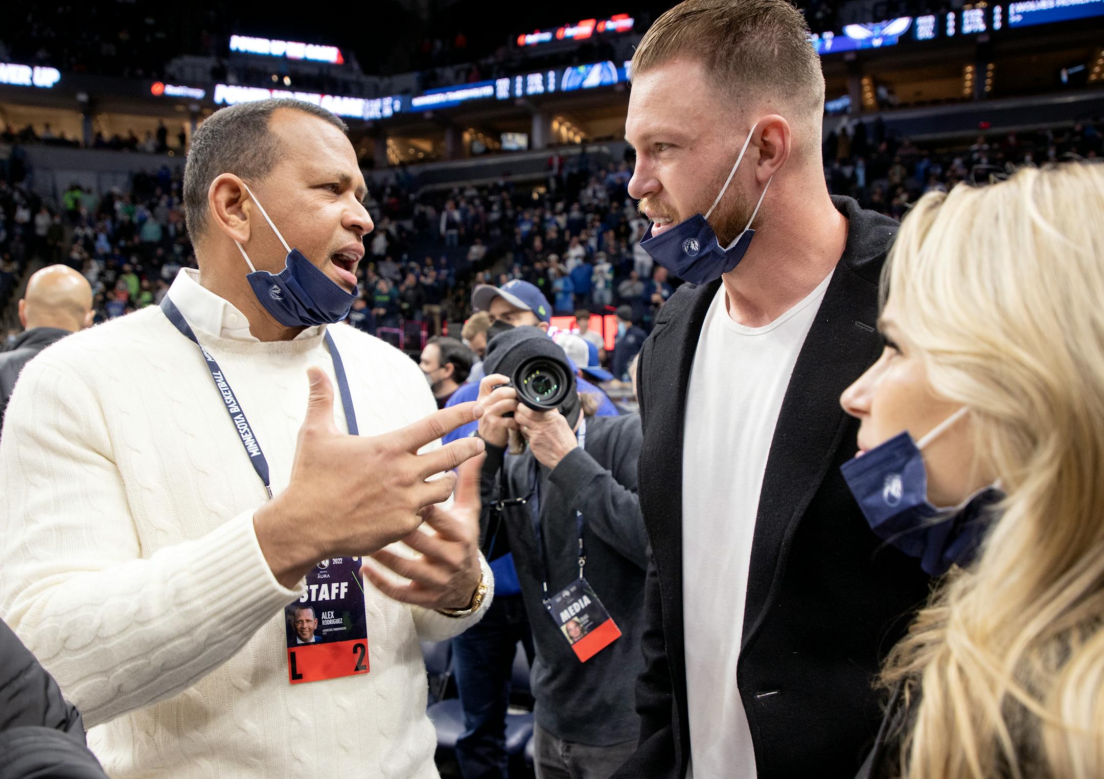Alex Rodrigues talks with Kyle Rudolph before the start of the game.